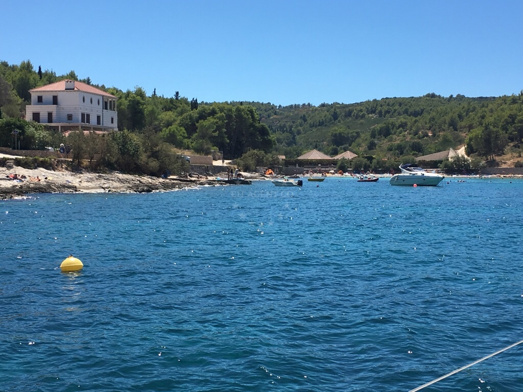 Shoreline of Uvala Likva, Sutivan, Brac, Croatia with nearby swimming area