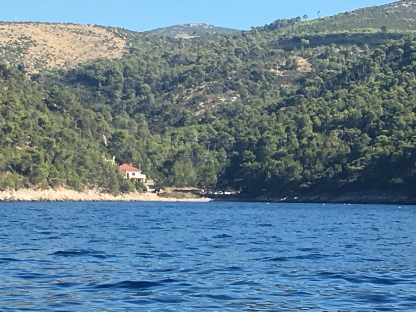 Anchorage on Hvar Island with Sviracina beach in the distance, calm waters and scenic coastal views