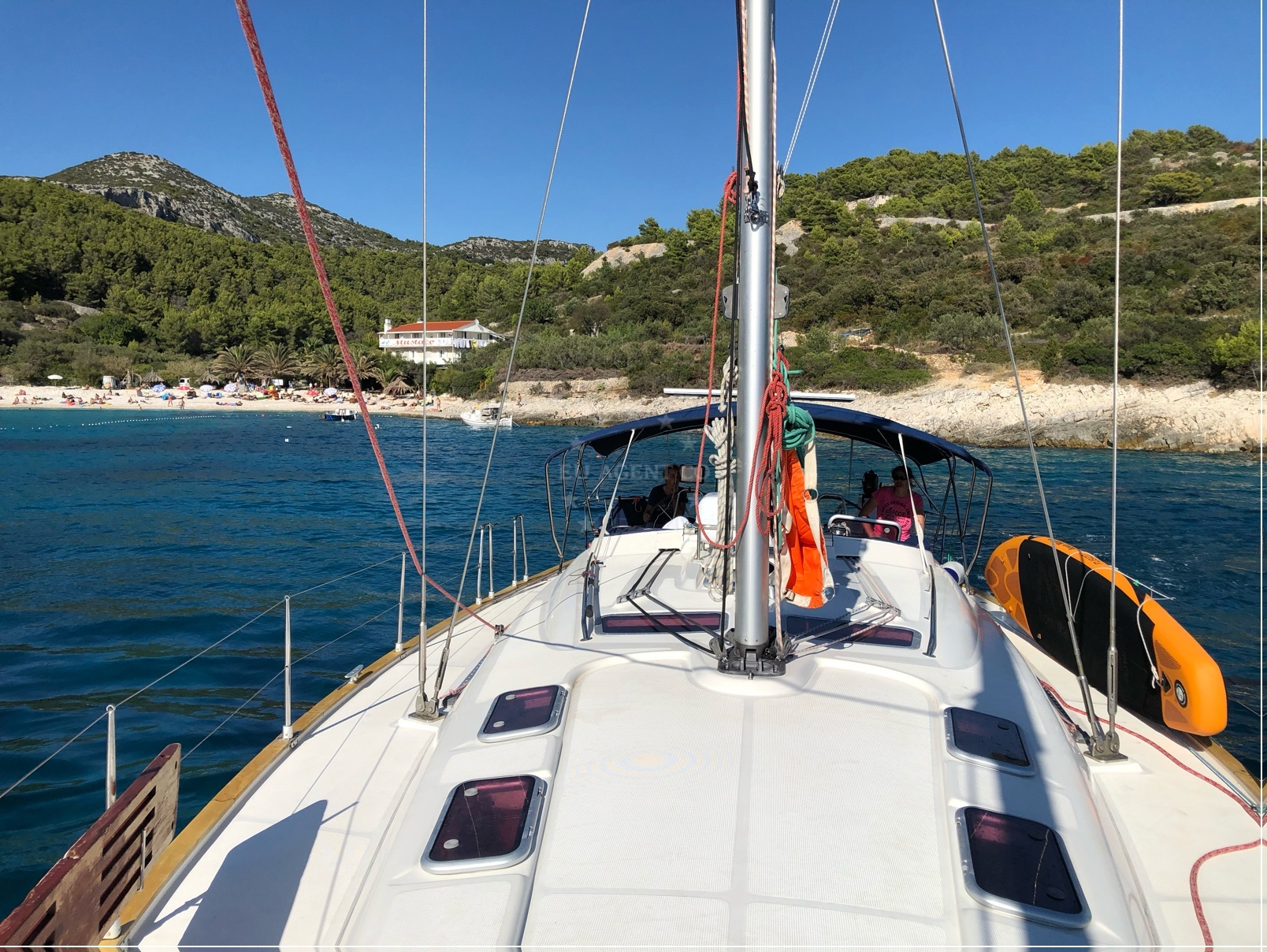 Sailboat anchored near Hvar, Croatia with views of the island and surrounding coves