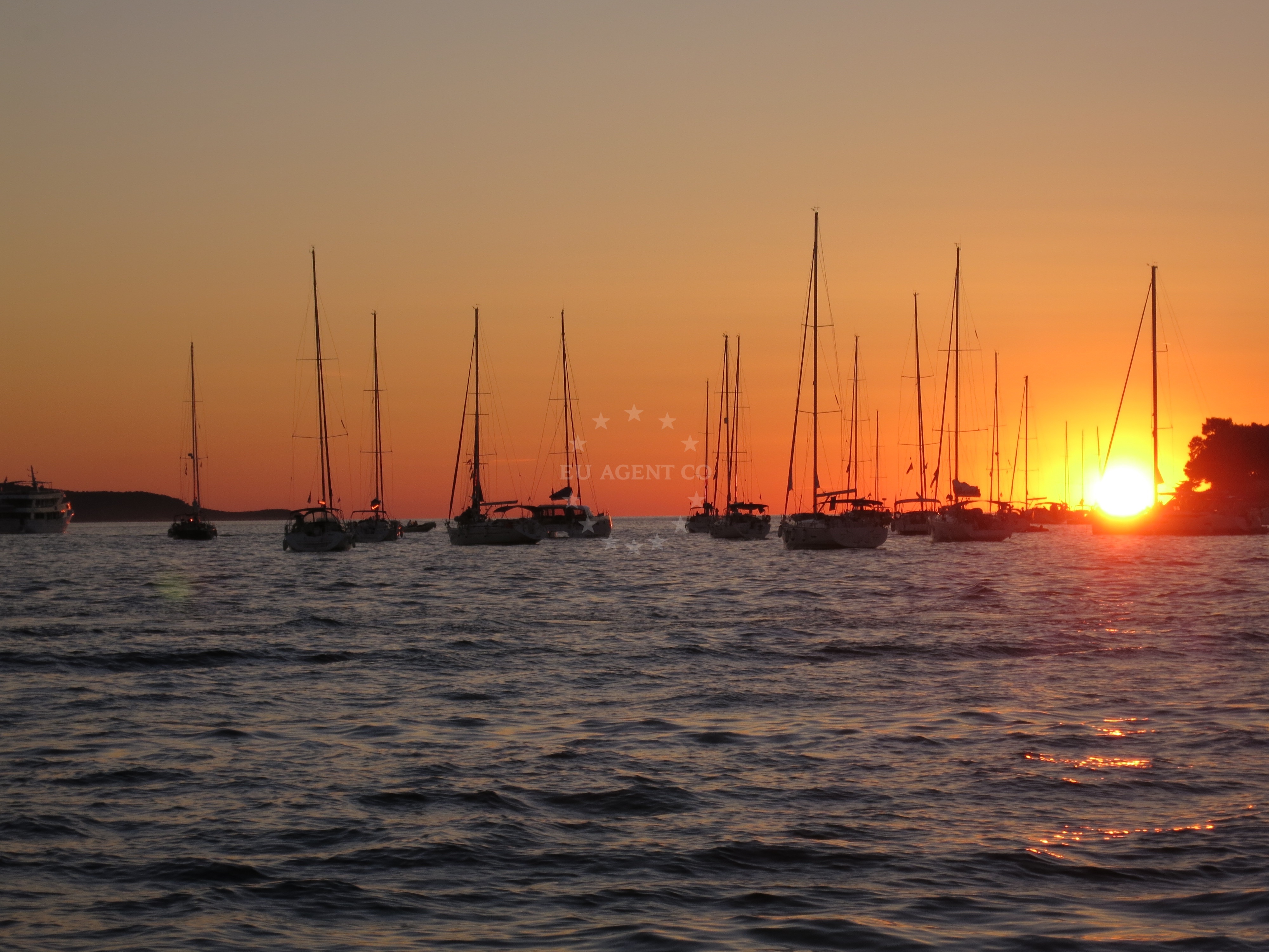Yacht anchoring in calm waters near Hvar town