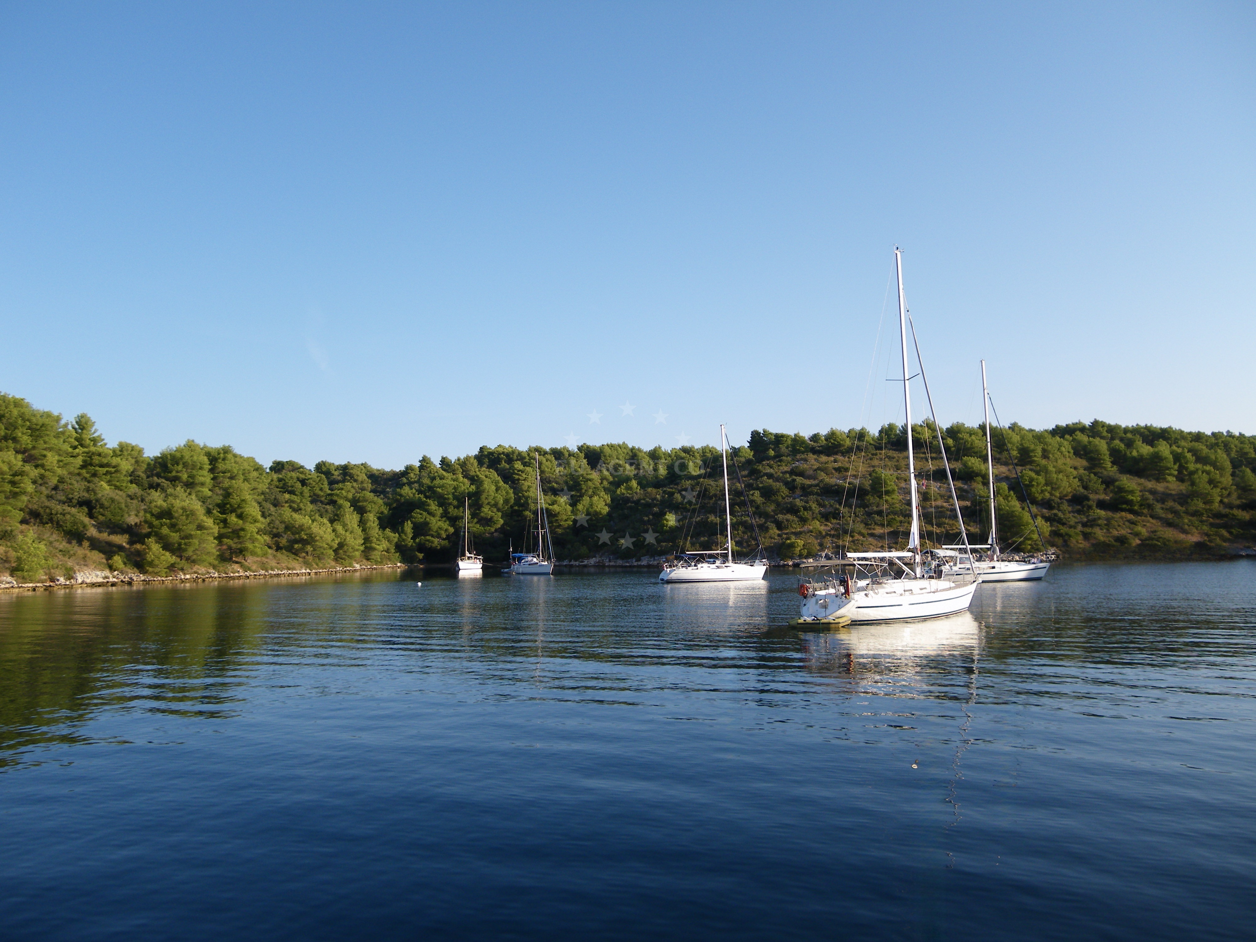 Anchorage in Stari Grad, Hvar: Uninhabited bay luka Tiha with calm waters and distant views of the island.