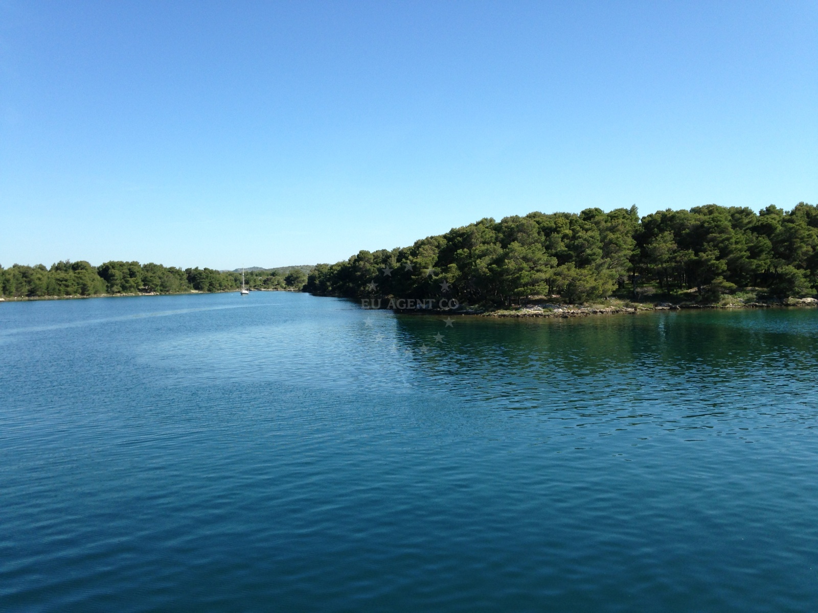 Šibenik anchorage with serene natural surroundings and calm waters