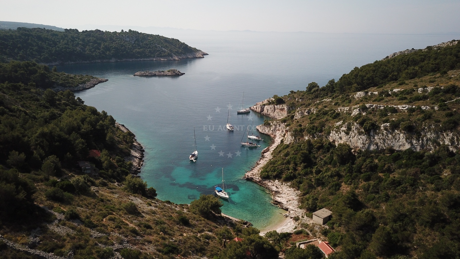 Anchorage on Šolta Island with sandy seabed and view of Tatinja in the distance
