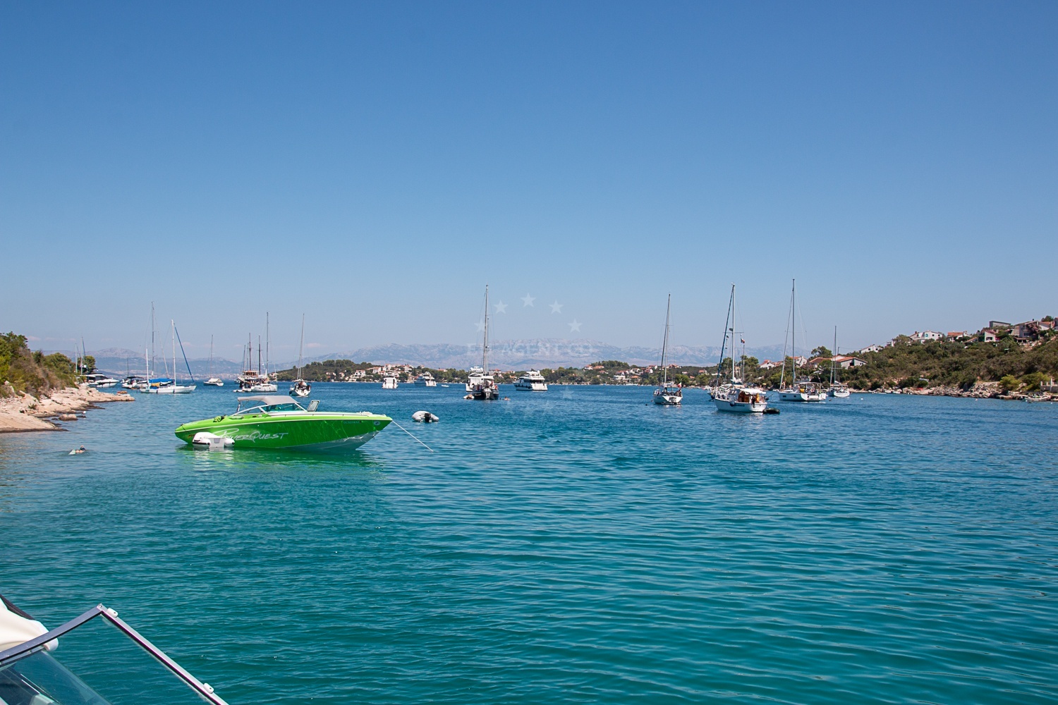 Yacht anchoring in Necujam, Šolta, Croatia near the shore