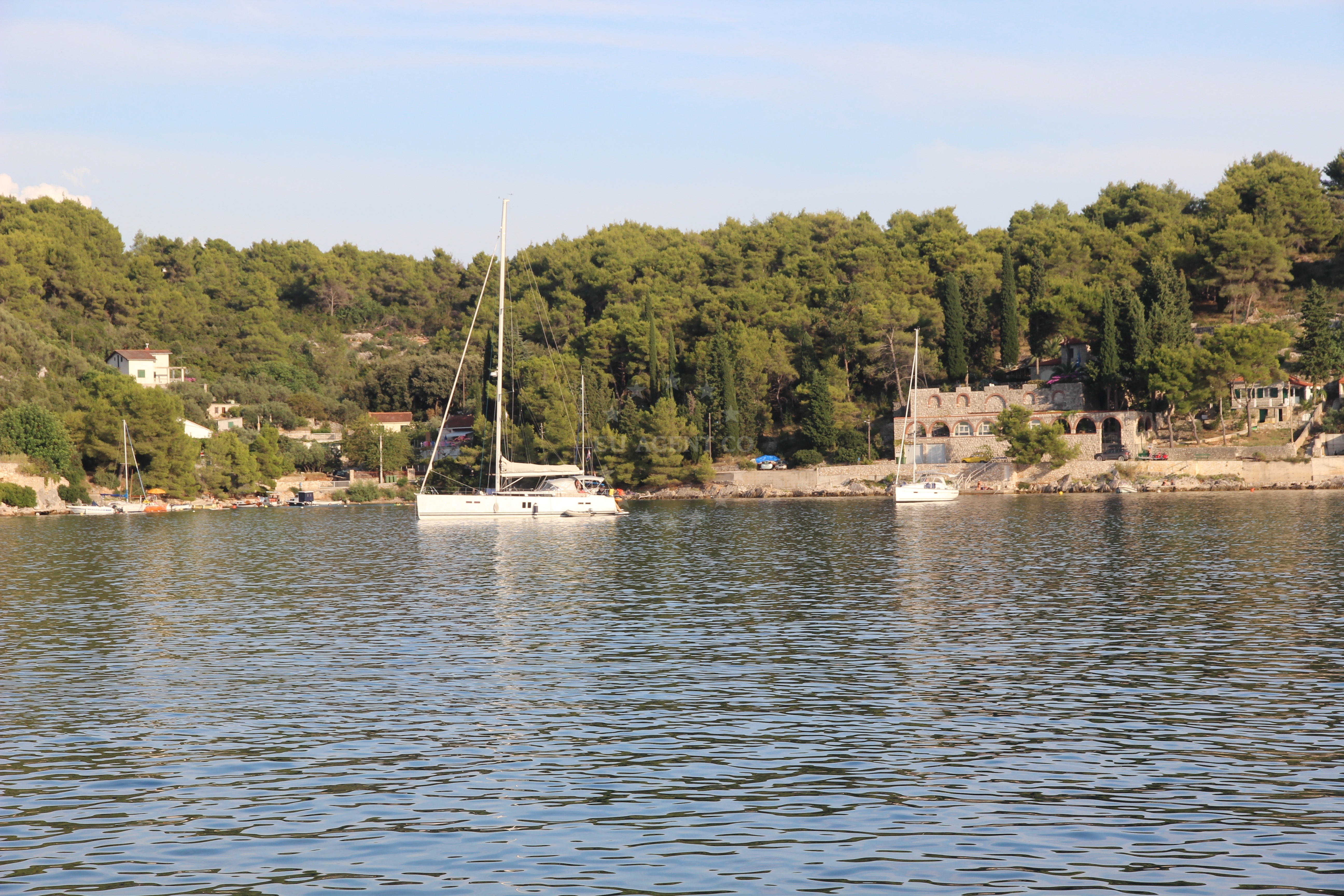 View of Rogac Anchorage, Solta, Croatia with boats anchored near the shore