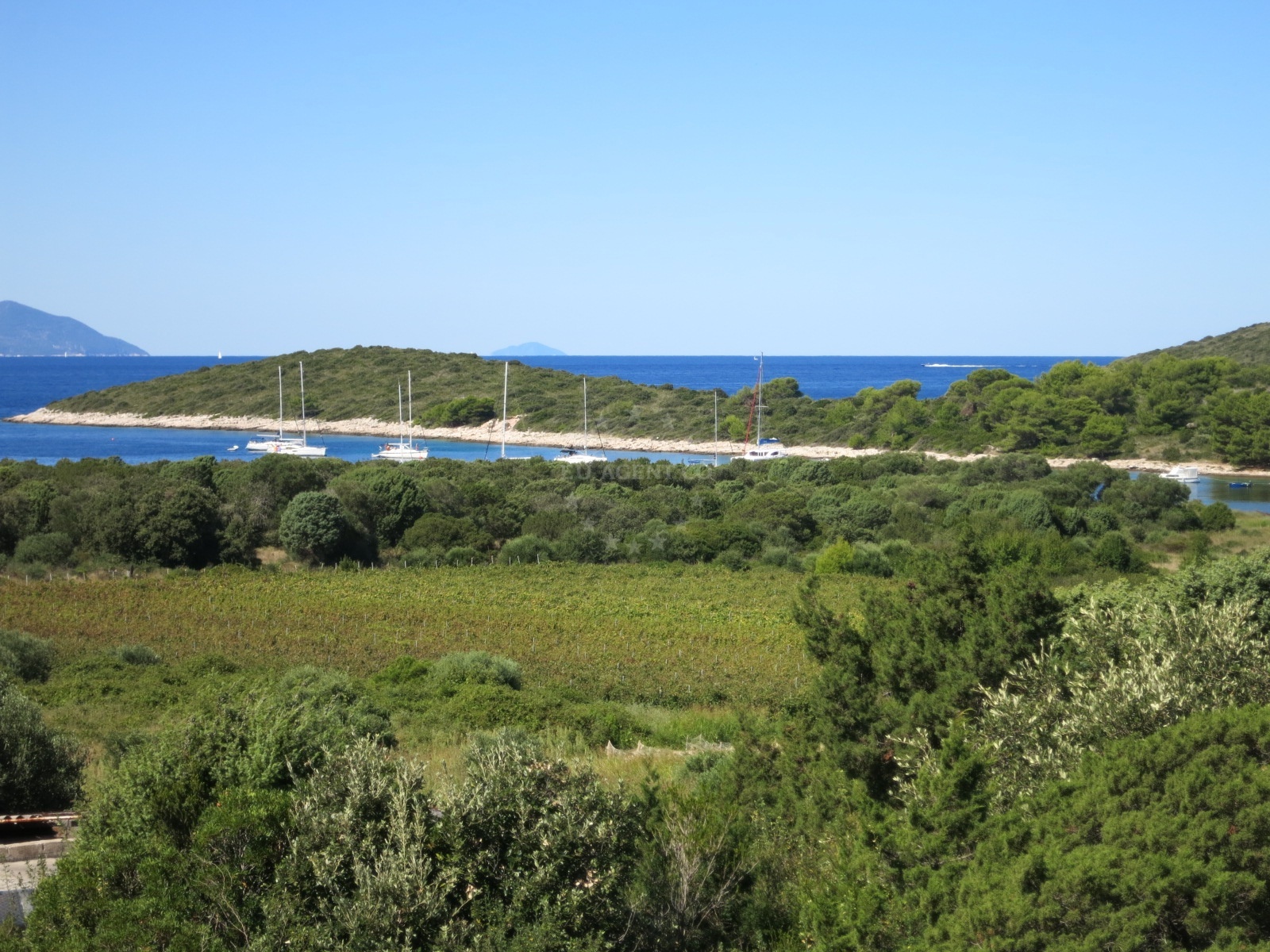 View of Vlaka anchorage with nearby buoy fields and coastal scenery
