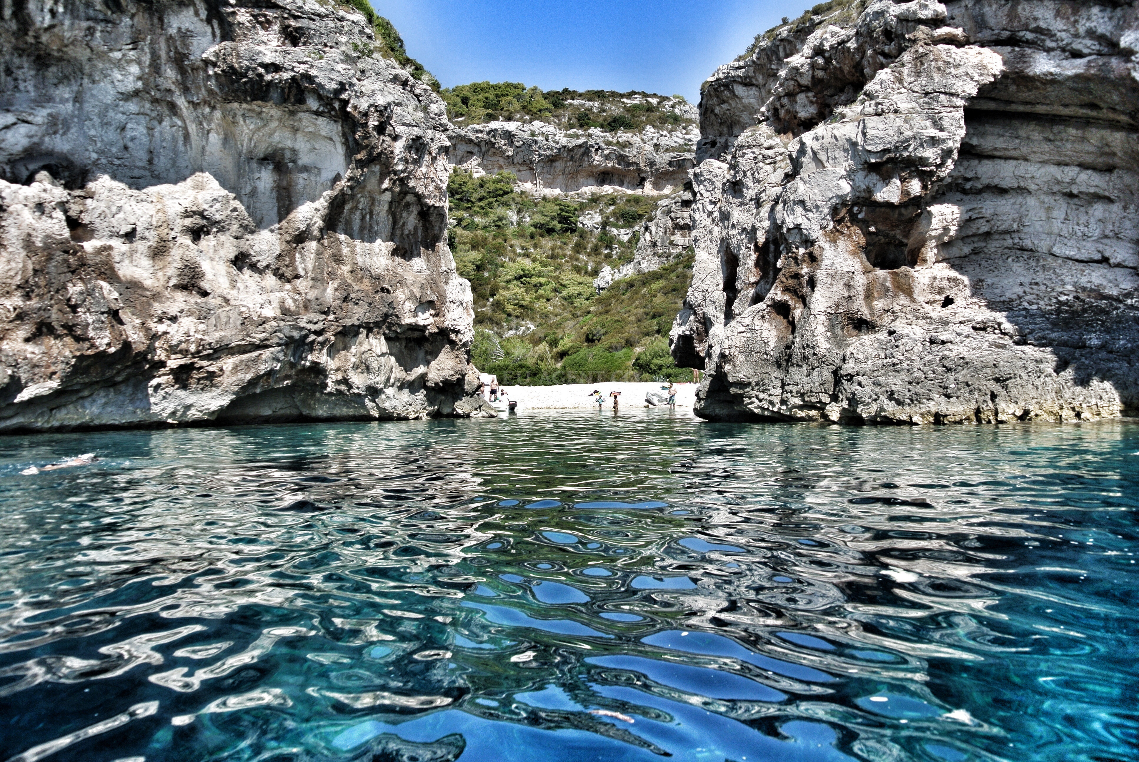 Stiniva Beach on Vis Island, Croatia, with clear waters and rocky shoreline