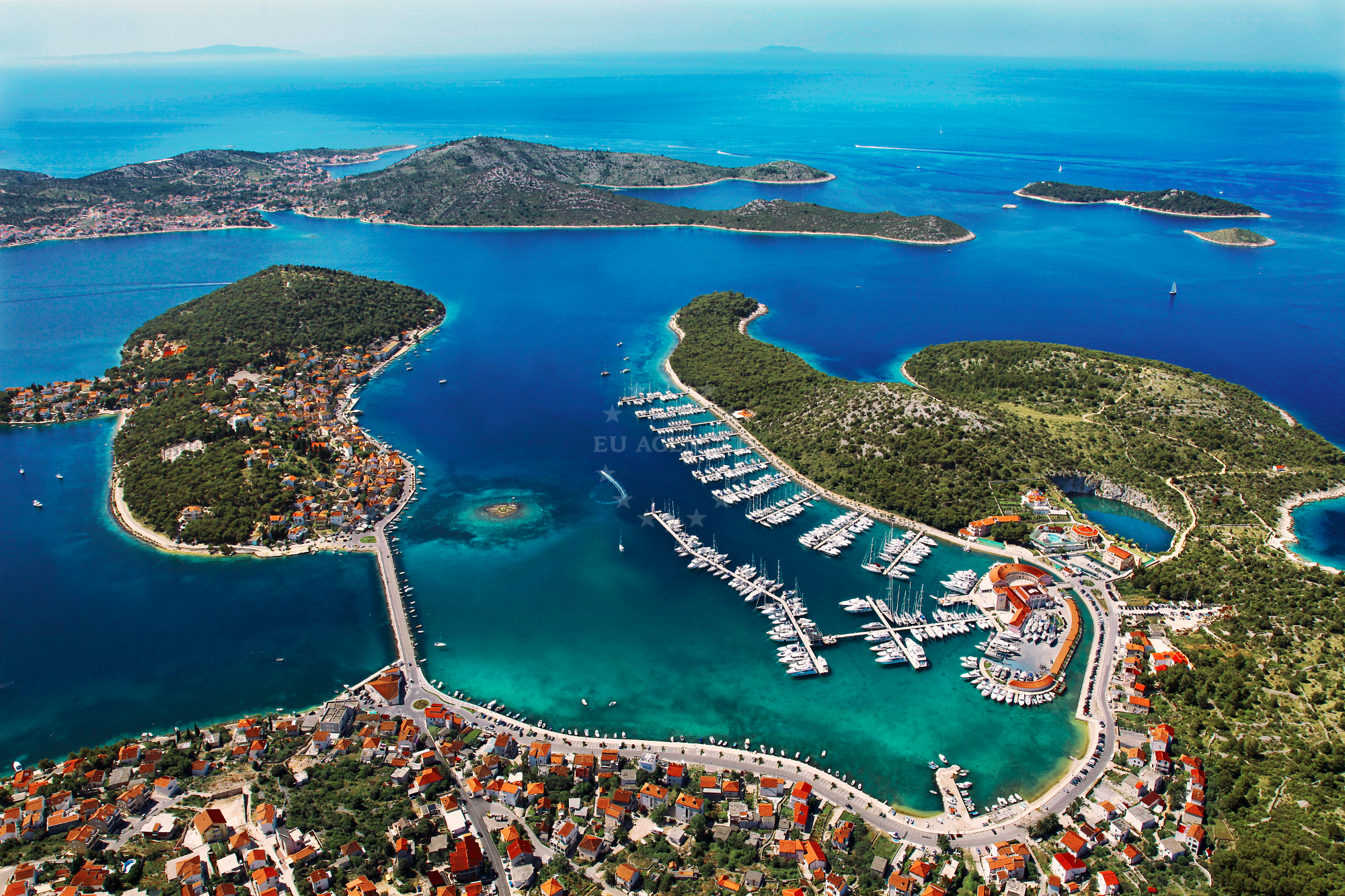 Anchorage Zaboric, Croatia with boats moored in shallow waters