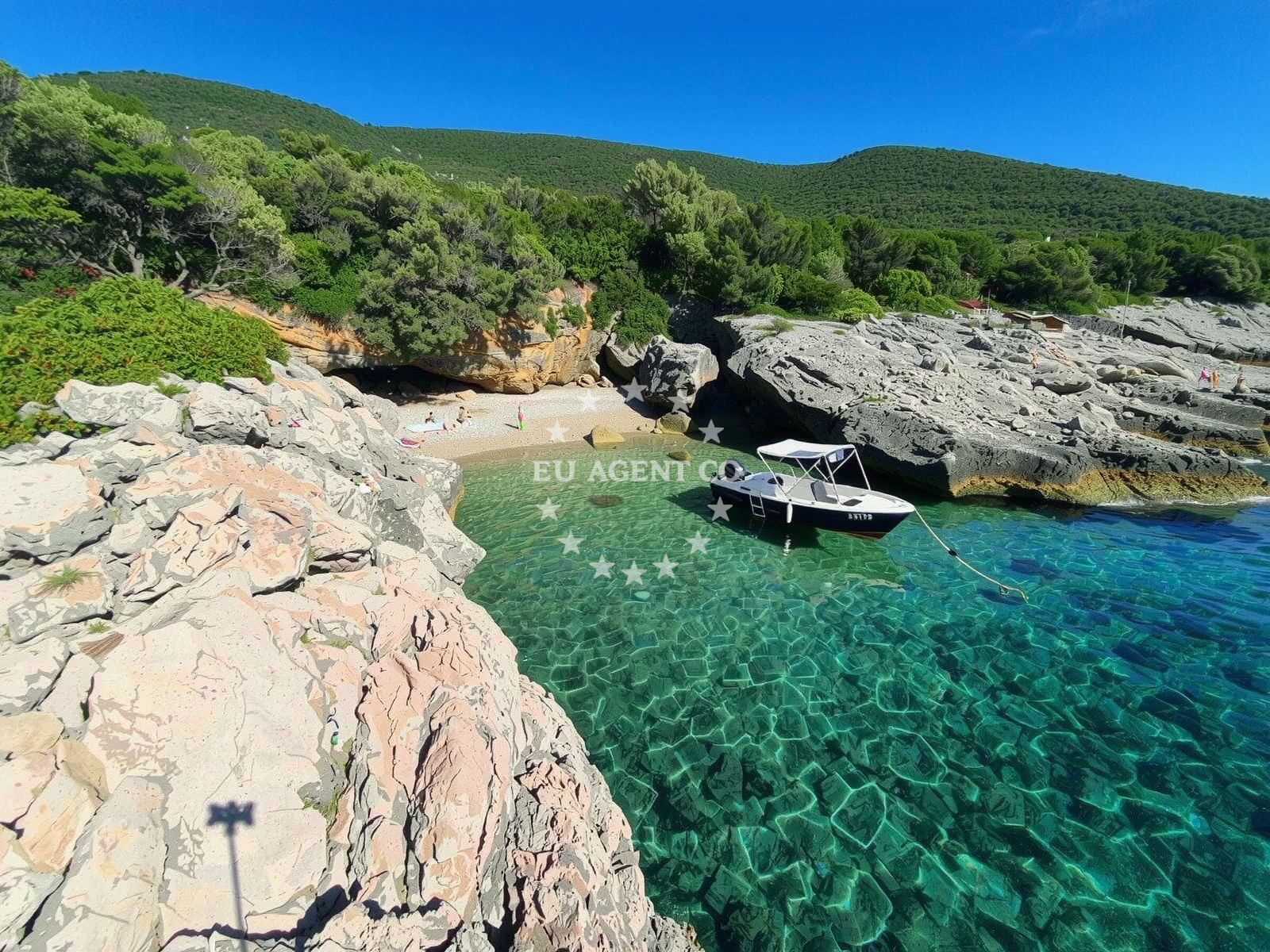 Anchorage in Martinscica, Cres with clear Adriatic waters and nearby coastal scenery
