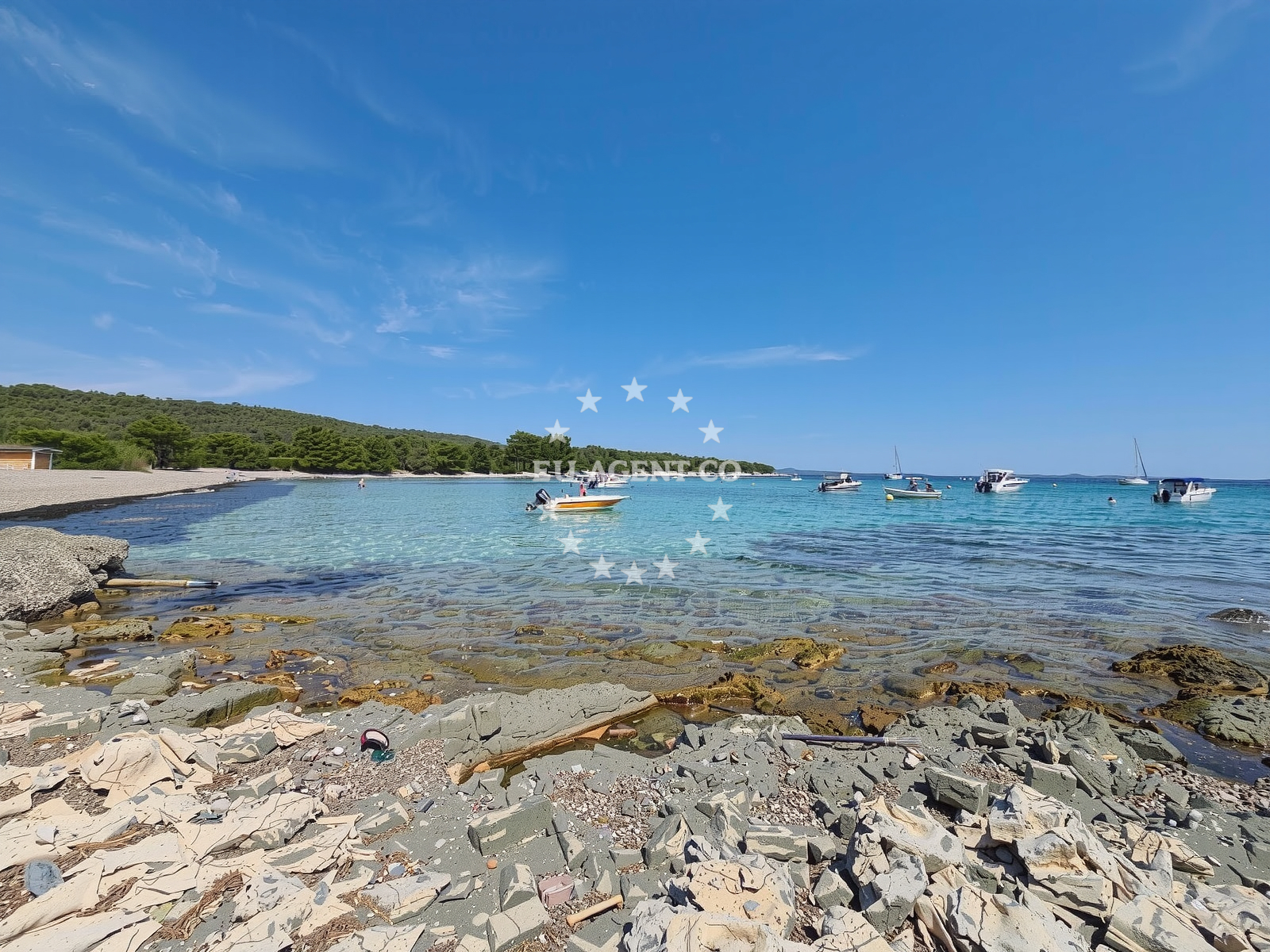 Beach near Ilovik Island anchorage with clear waters and rocky shoreline