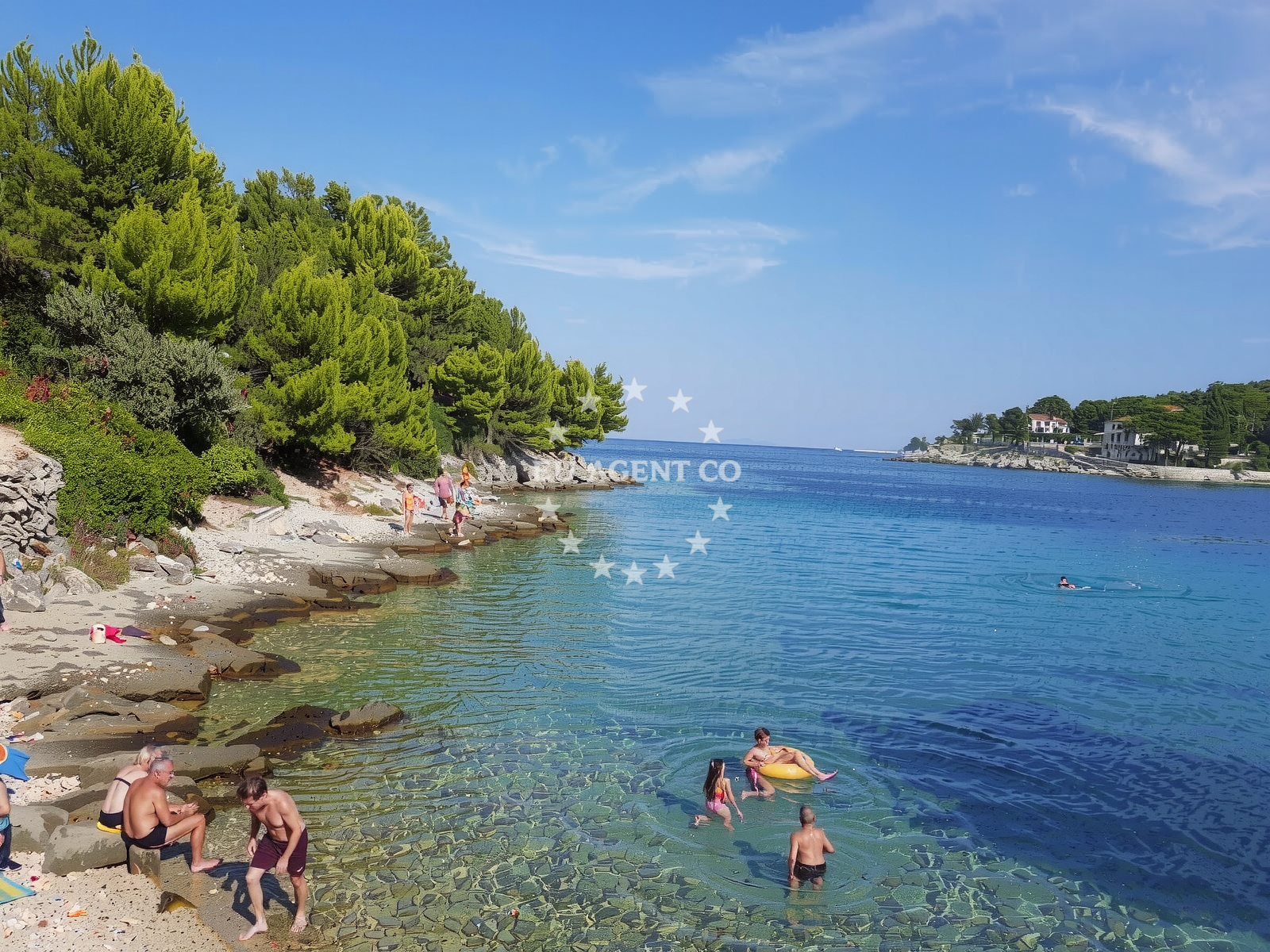 Anchorage in Mali Losinj, Croatia with sandy seabed and nearby Baldarka village