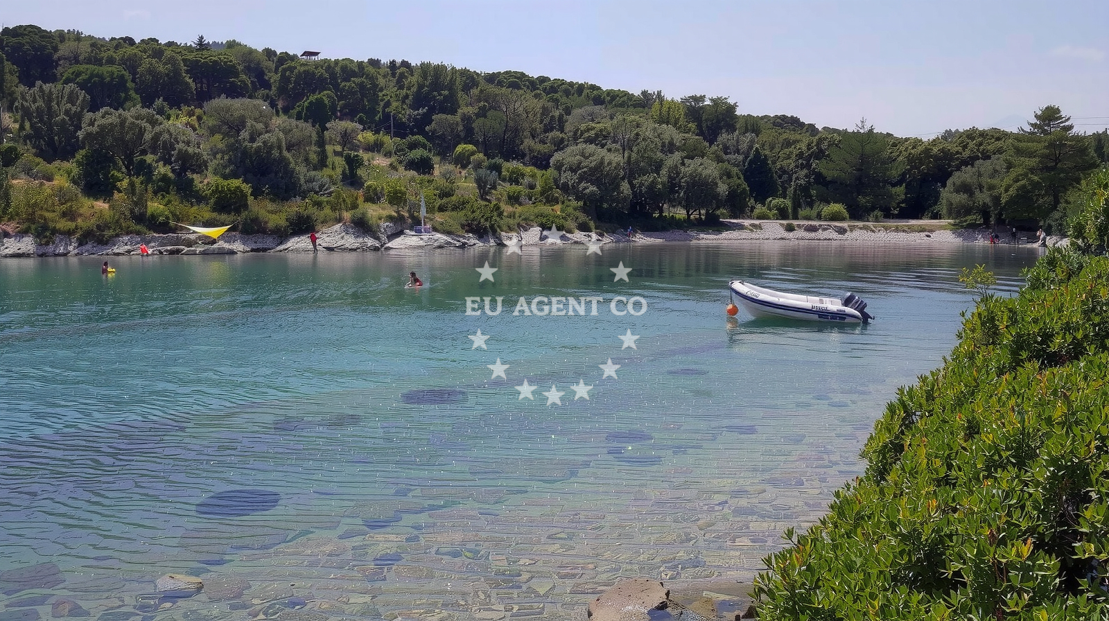 Sandy anchorage in Mali Losinj, Croatia with boats moored in calm waters