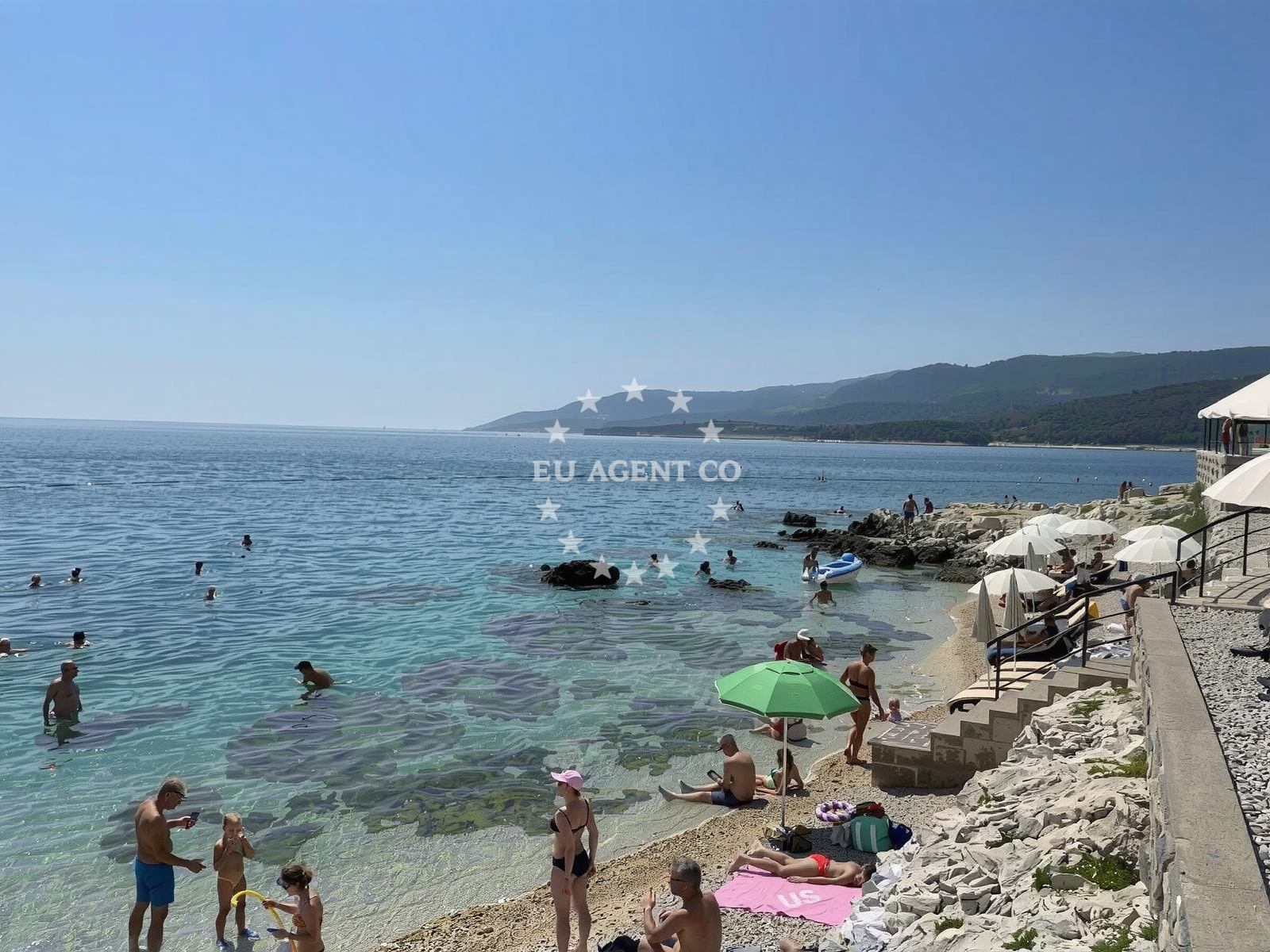 Amfora Beach in Rabac, Croatia, with clear waters and scenic coastal views.