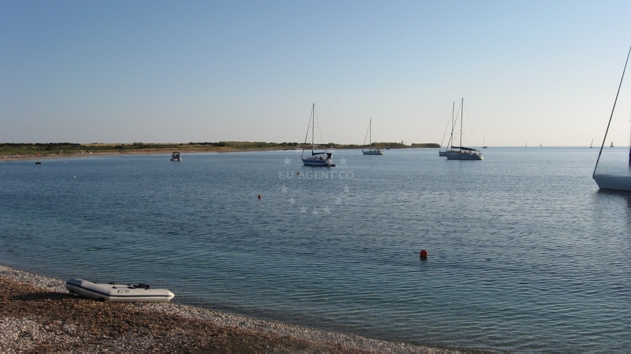 Anchorage in Unije, Croatia with calm waters and nearby island views