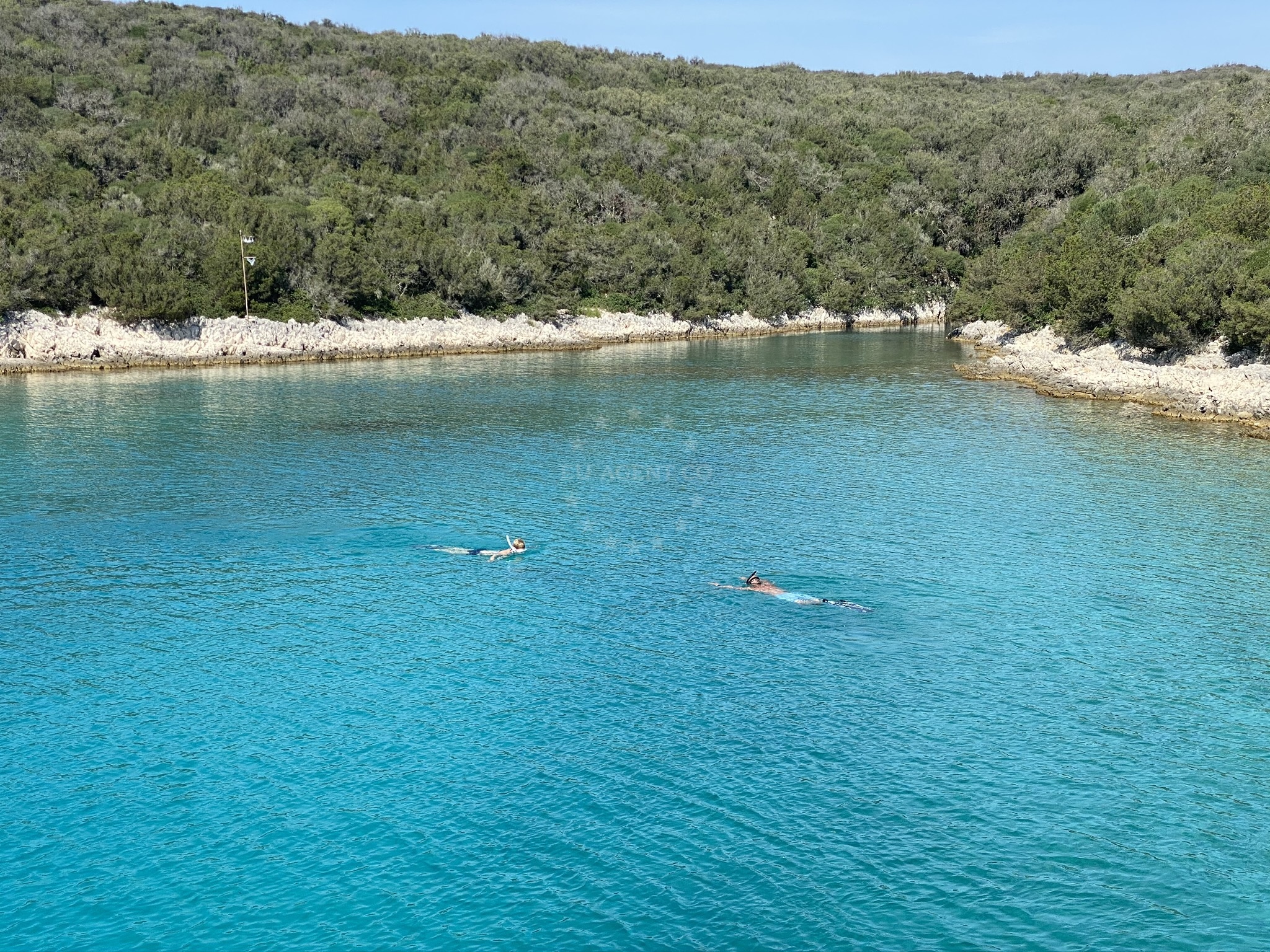 Anchorage on Unije Island, Croatia with sandy seabed and distant coastal views