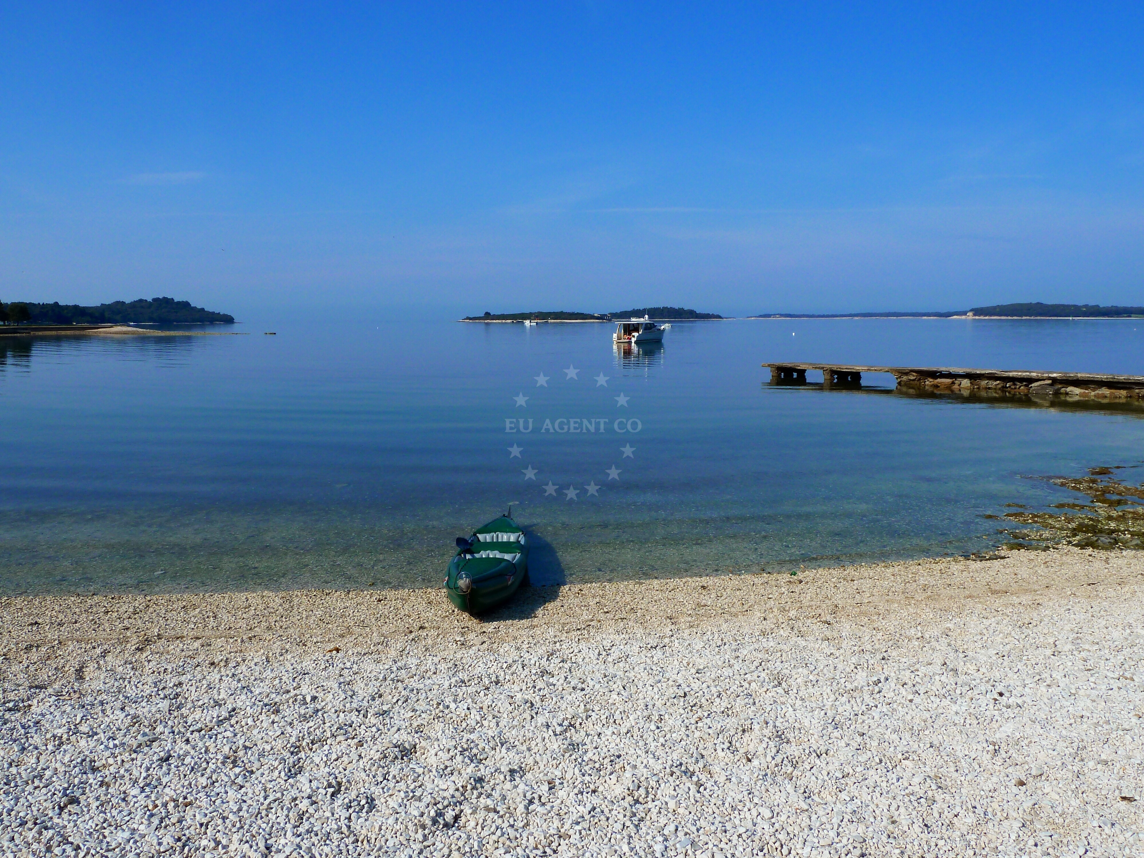 Anchorage in Valbandon, Istria, Croatia with nearby Runci and Pula in the distance