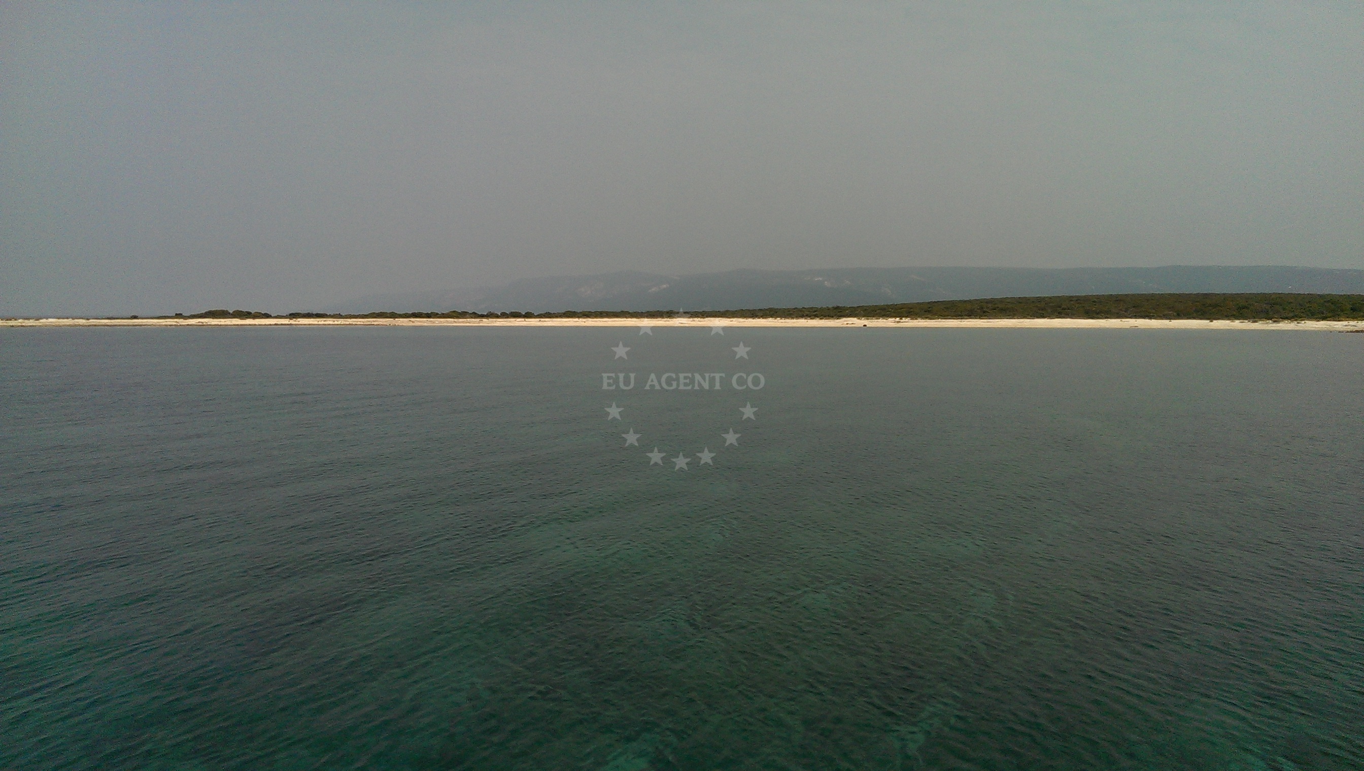 Anchorage on Zeca Island with calm waters and nearby Slanci coastal landmark