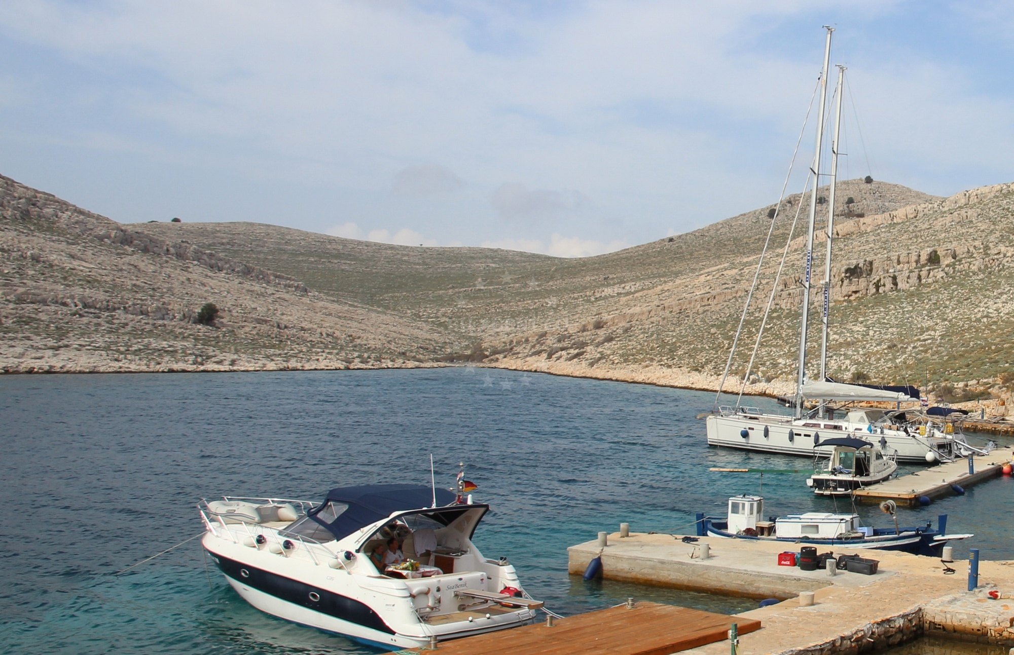 Anchorage on Kornat Island with calm waters and nearby Konoba Opat jetty