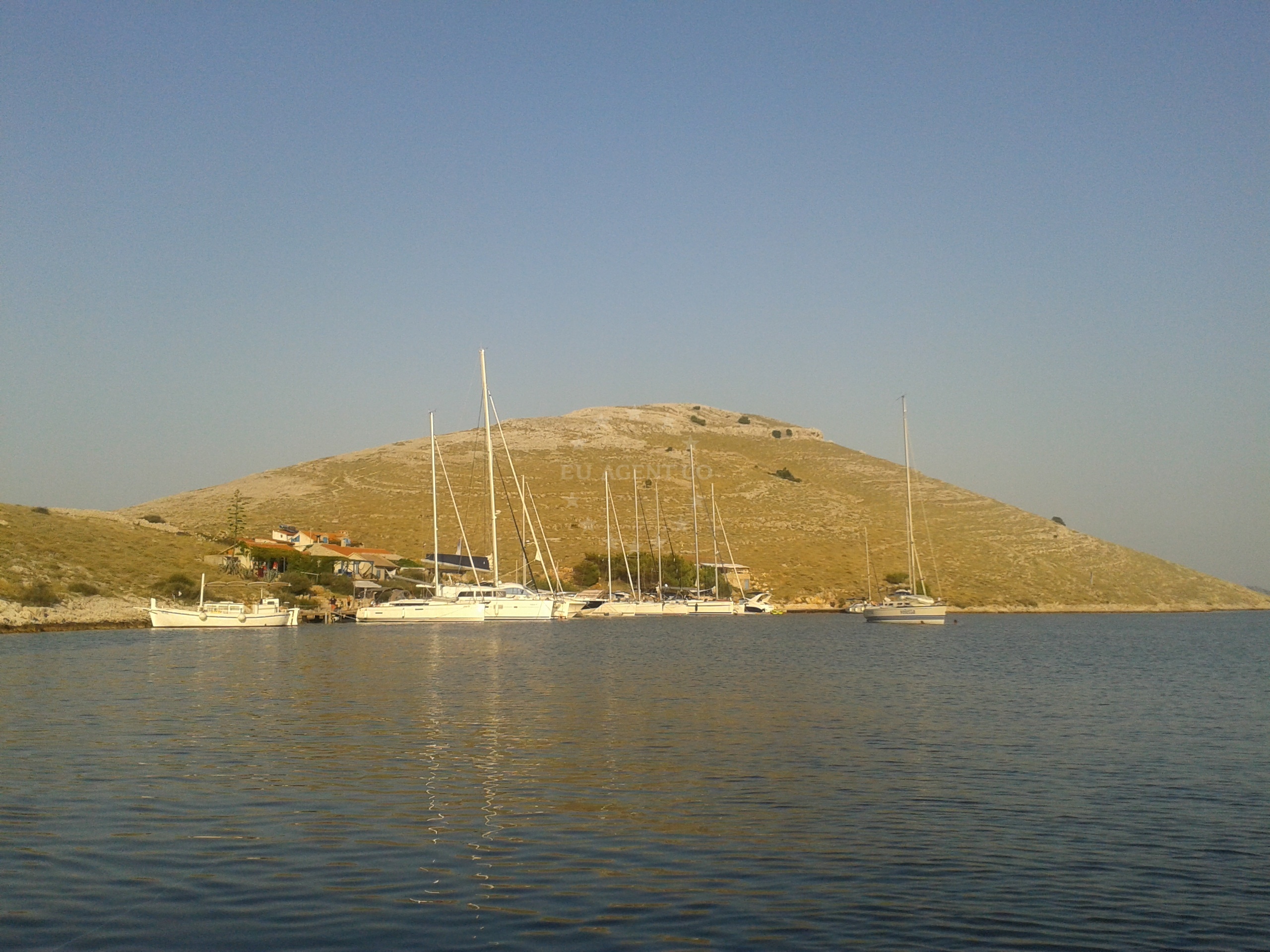 Yacht anchored at Kornat Island with sand and rock seabed visible