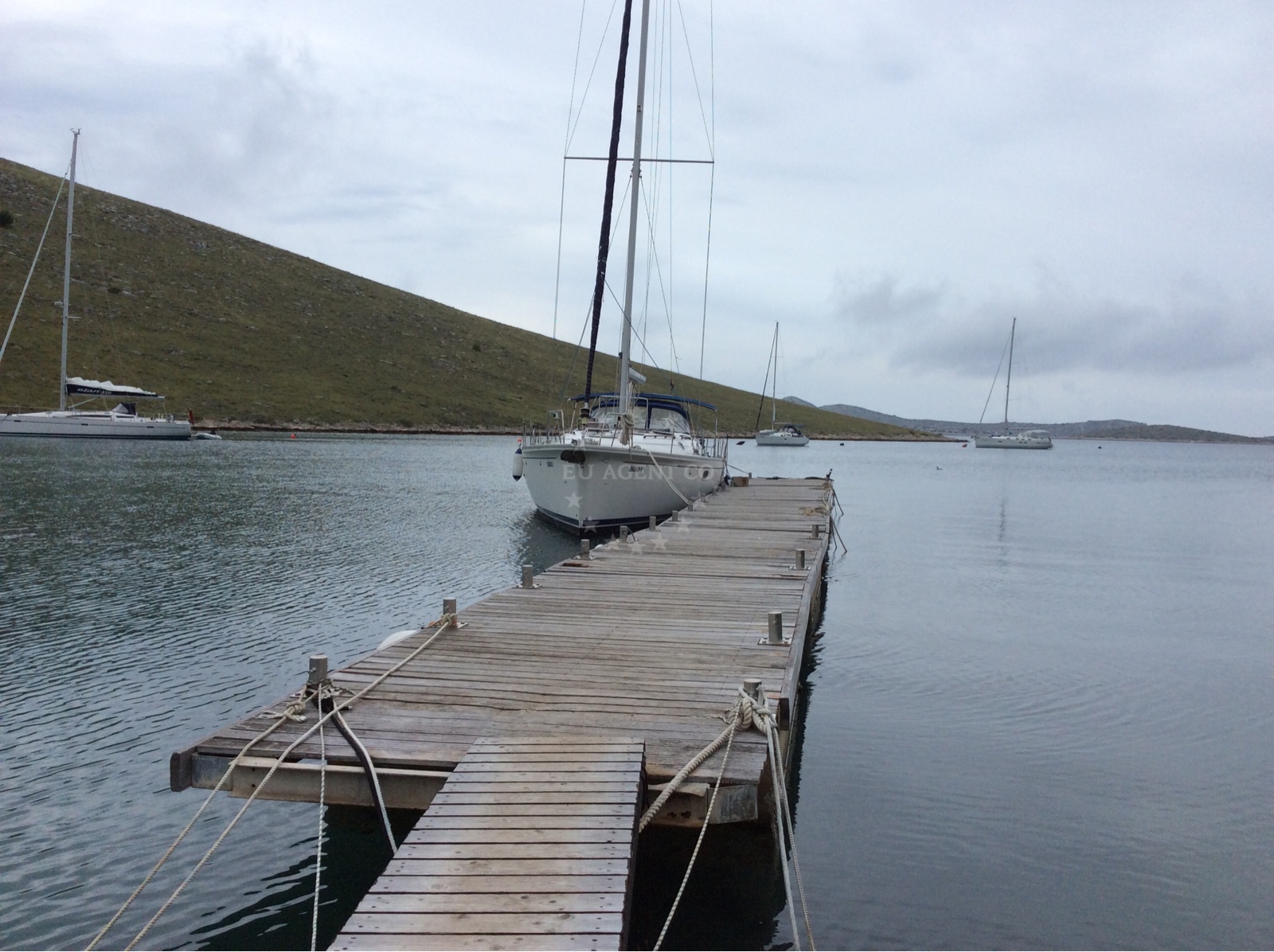 Boat anchored at Vrulje, Kornat with nearby jetty