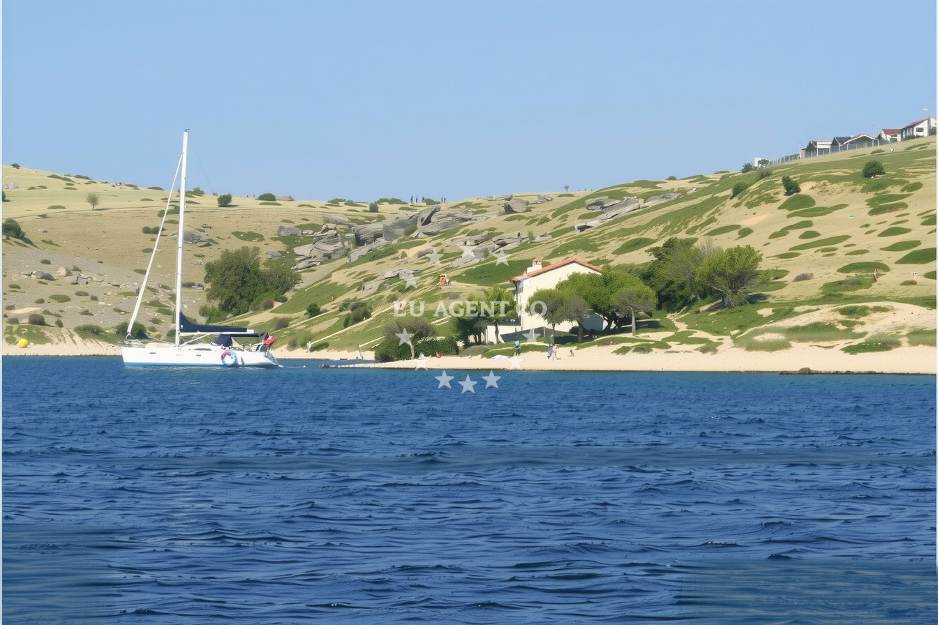 Anchorage view of Lavsa Island with calm waters and sand seabed