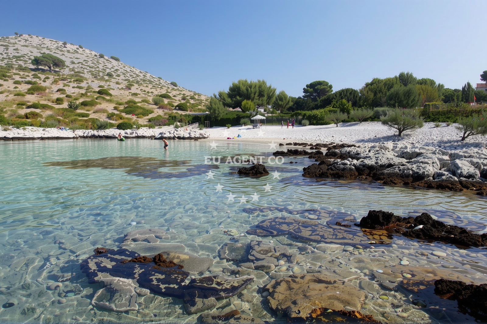 Lojena Beach on Levrnaka Island with clear waters and rocky shoreline