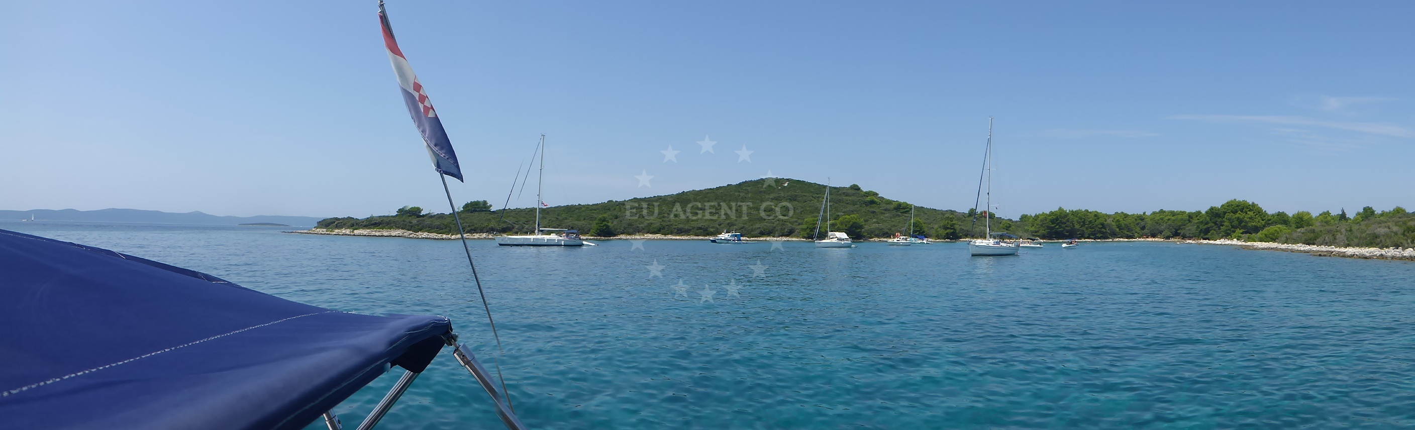 Sandy anchorage area on Molat Island with nearby coastal vegetation