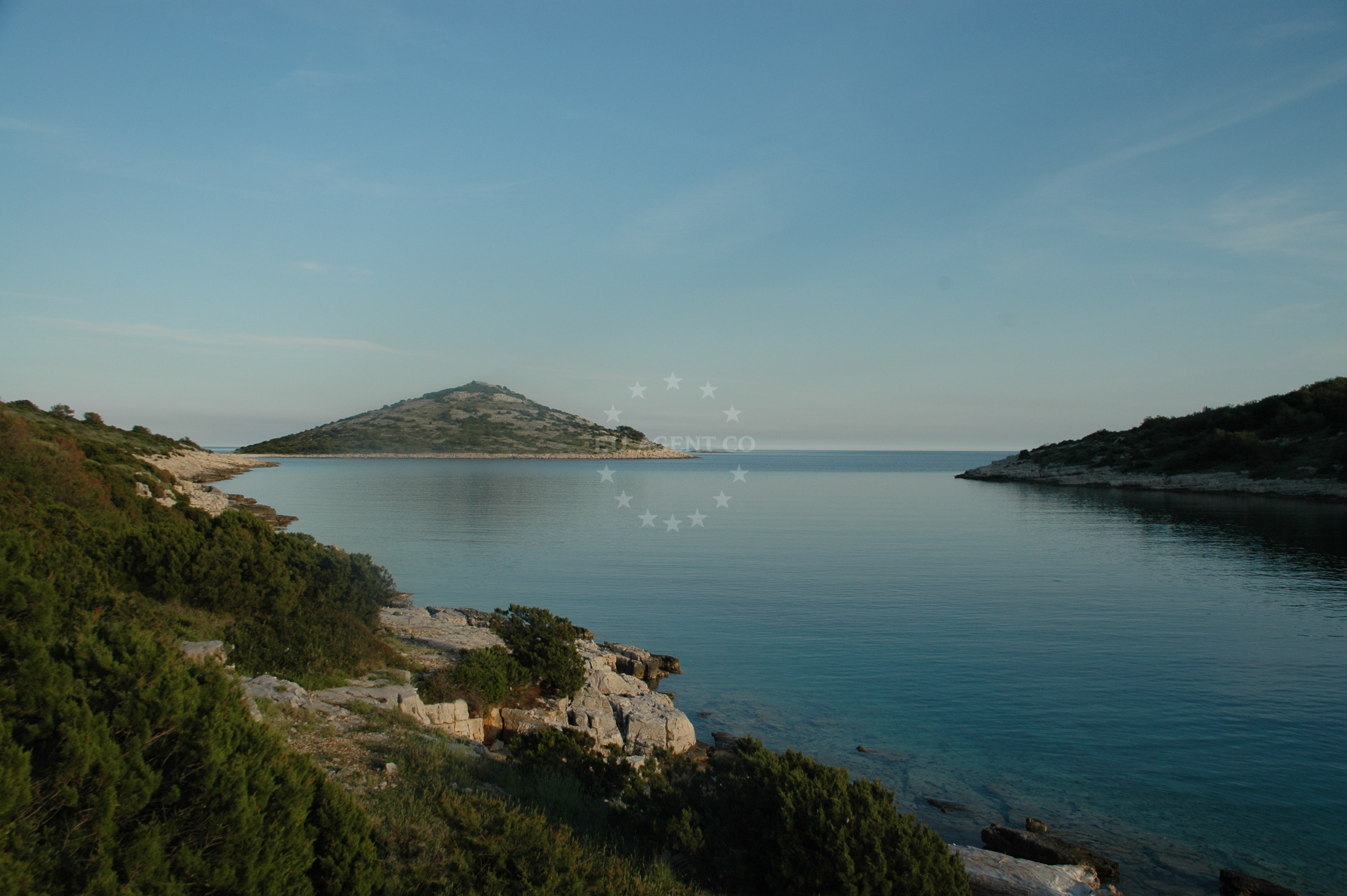 Boat anchored at Mala Stupica, Zirje Island, with nearby beaches and buoy fields visible