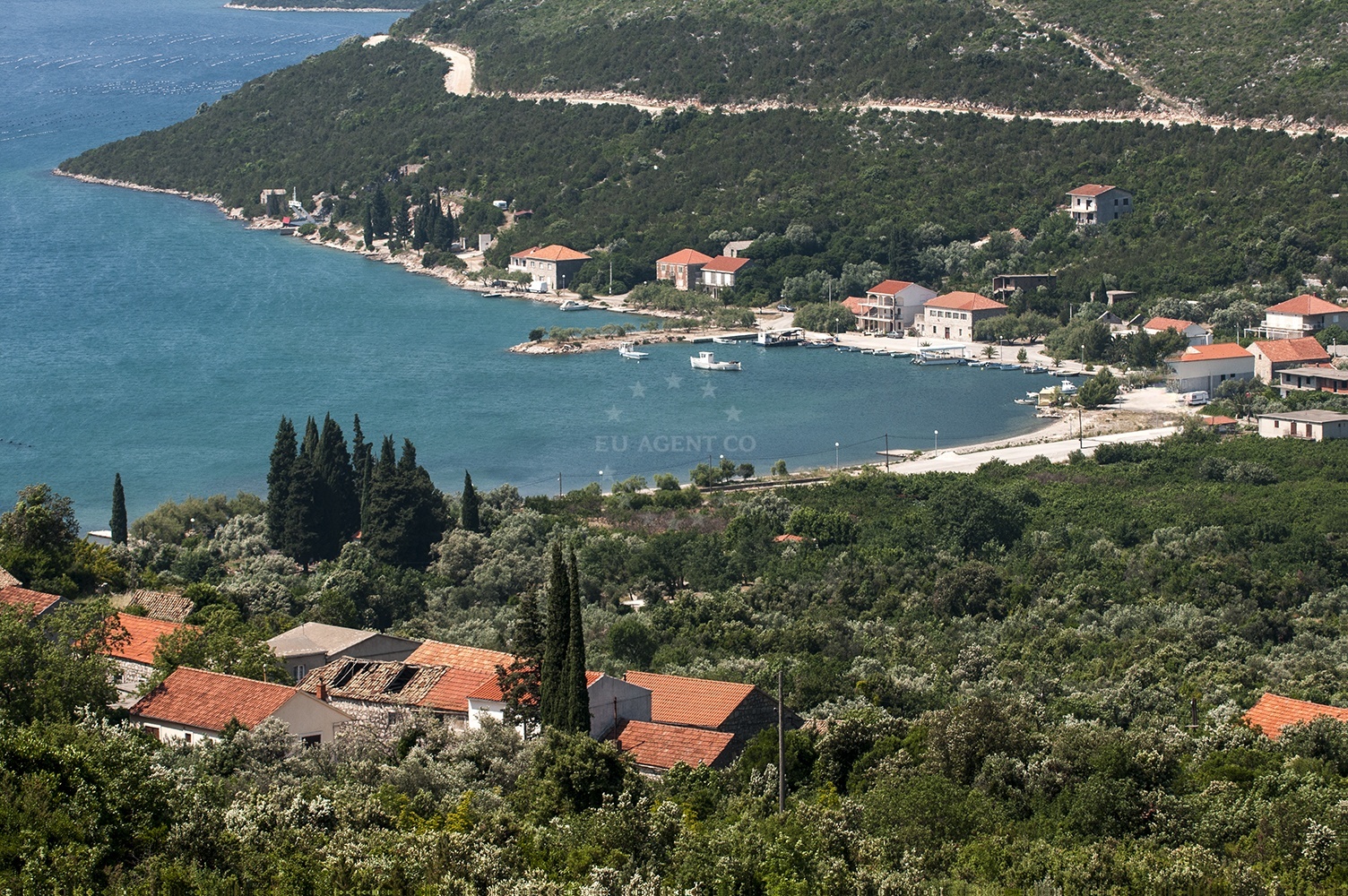 Brijesta Anchorage in South Dalmatia, Croatia with sandy seabed and nearby coastal landscape