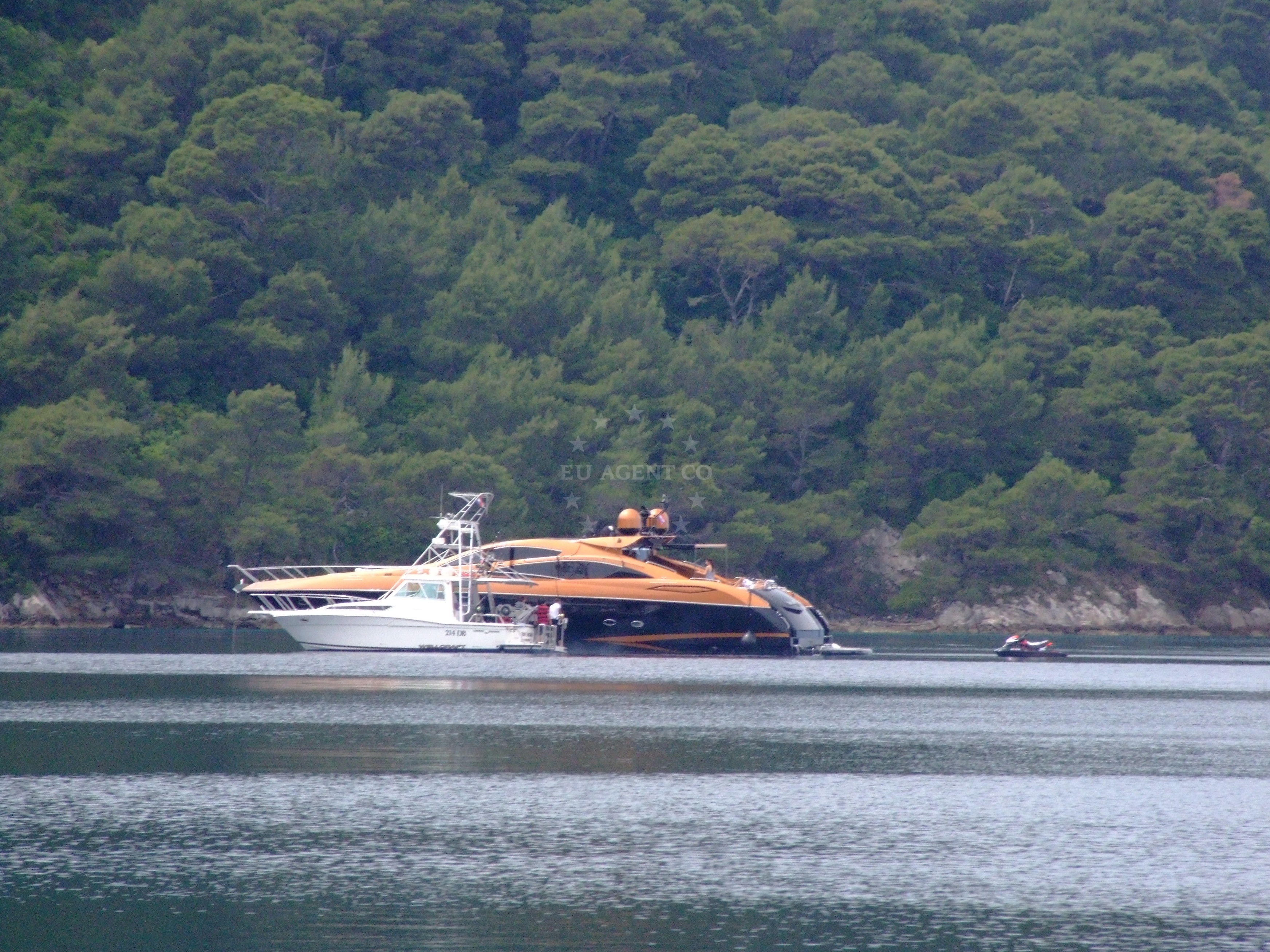 Anchorage on Jakljan Island, South Dalmatia, Croatia with clear waters and surrounding rocks.