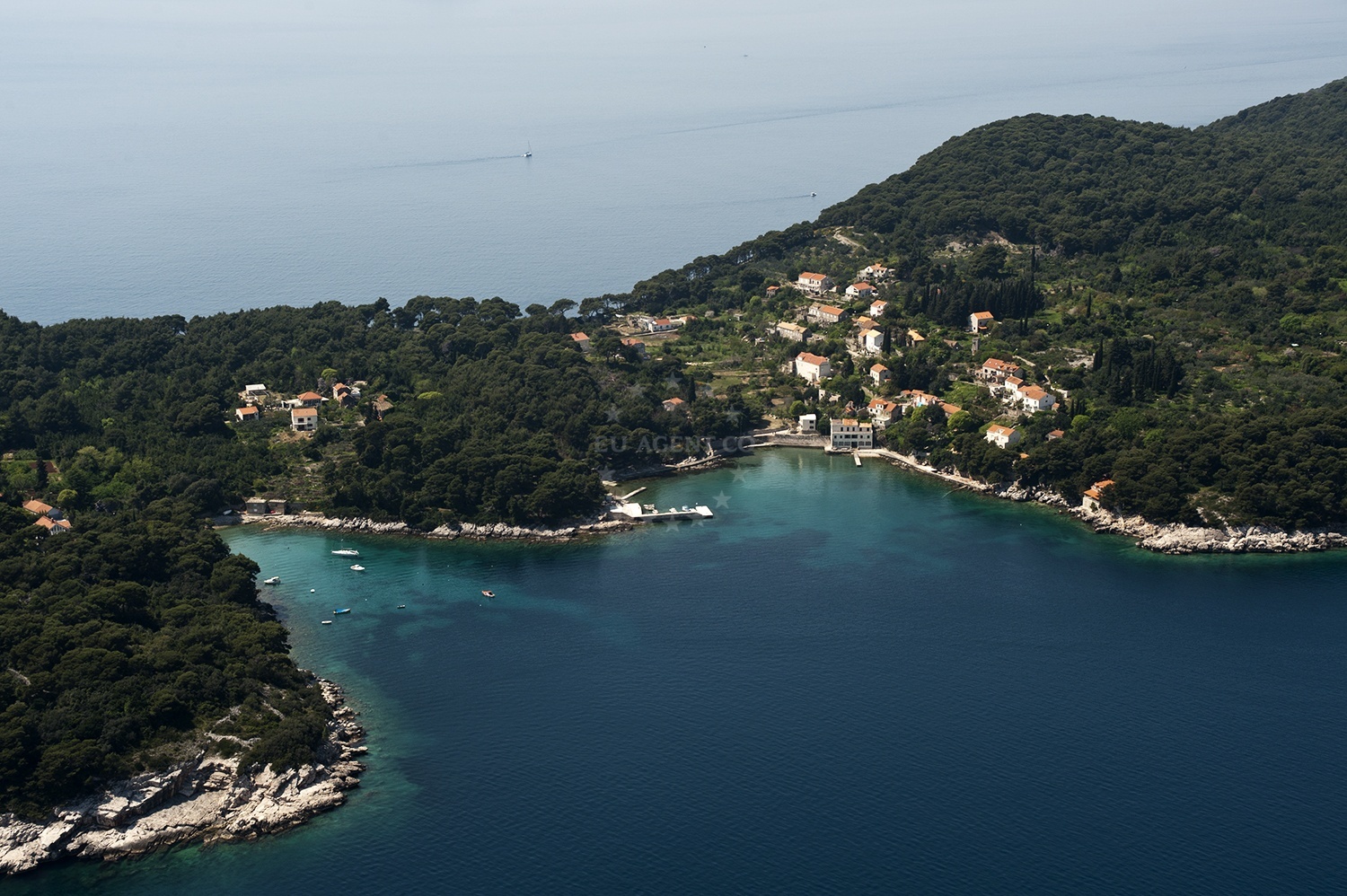 Anchorage on Kolocep Island, South Dalmatia, Croatia with sandy seabed and nearby jetty
