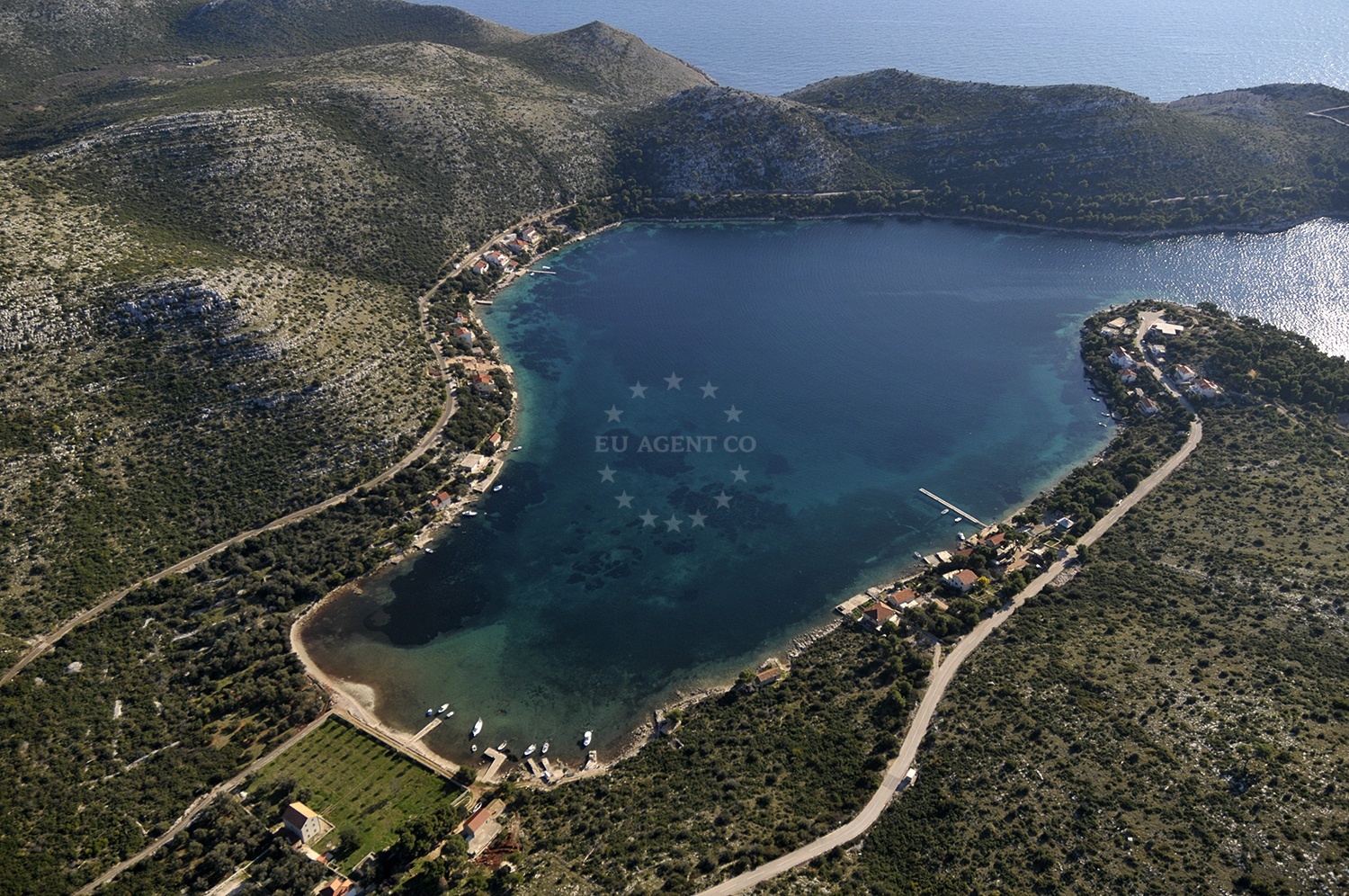 Skrivena Luka anchorage on Lastovo Island, Croatia, with dramatic cliffs and clear waters