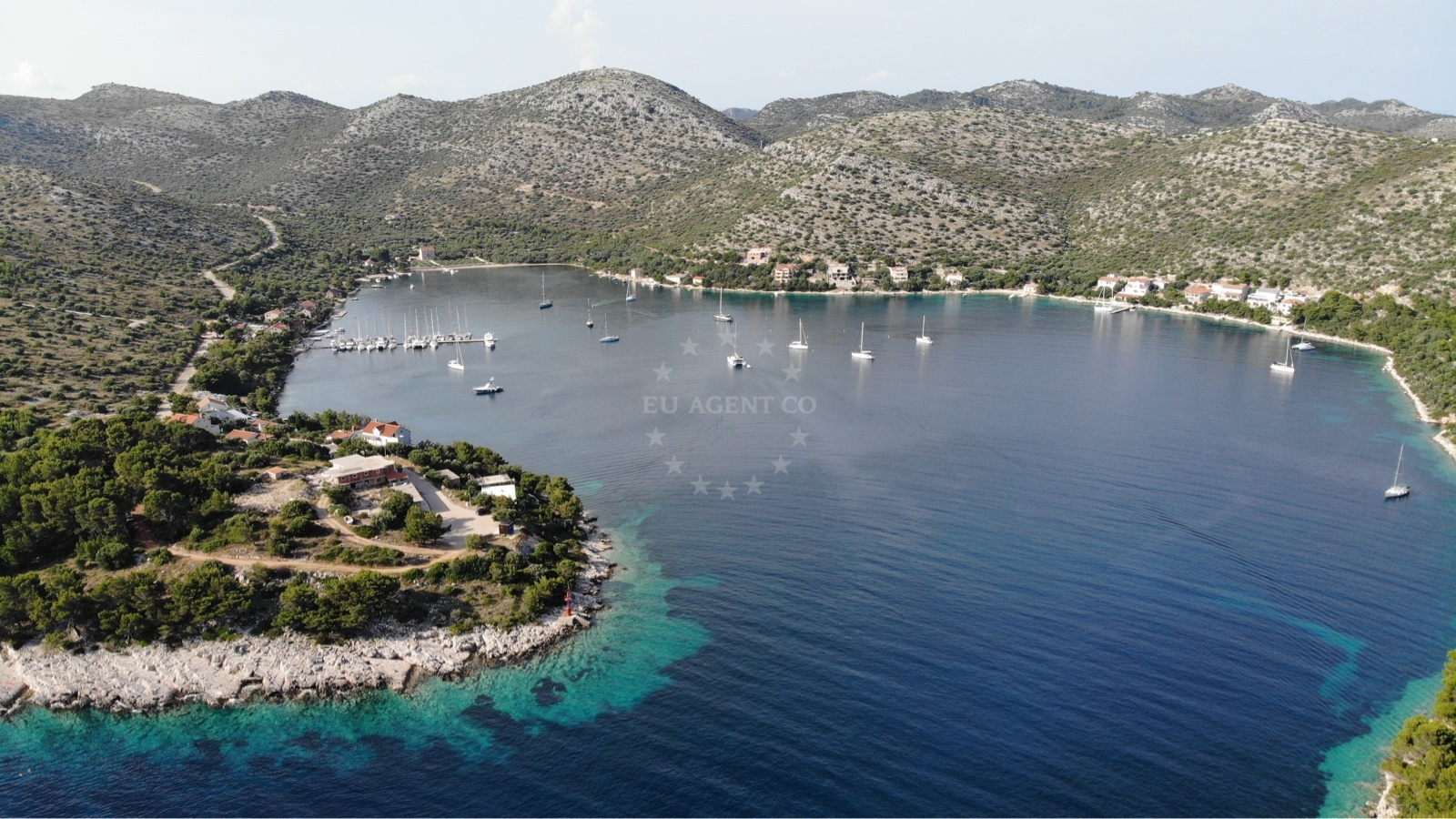 Boats anchored in Skrivena Luka, surrounded by natural scenery on Lastovo Island