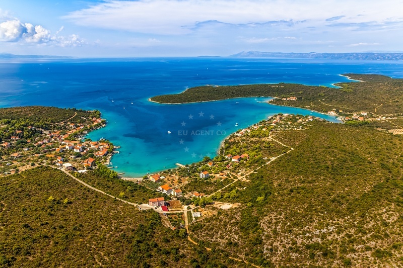 Sandy anchorage with views of Loviste village, Croatia