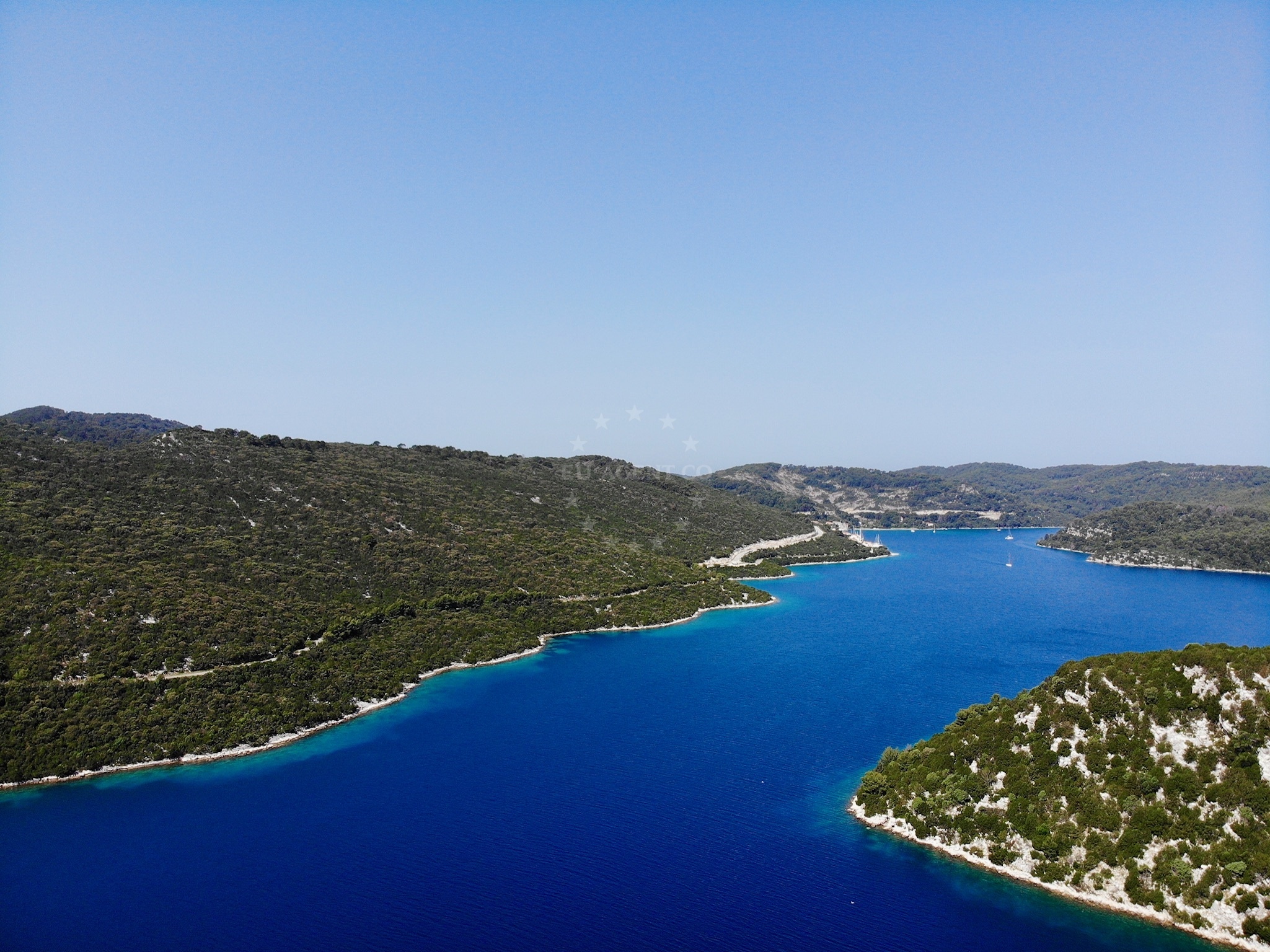 Anchored yacht at Polace, Mljet Croatia with distant island views