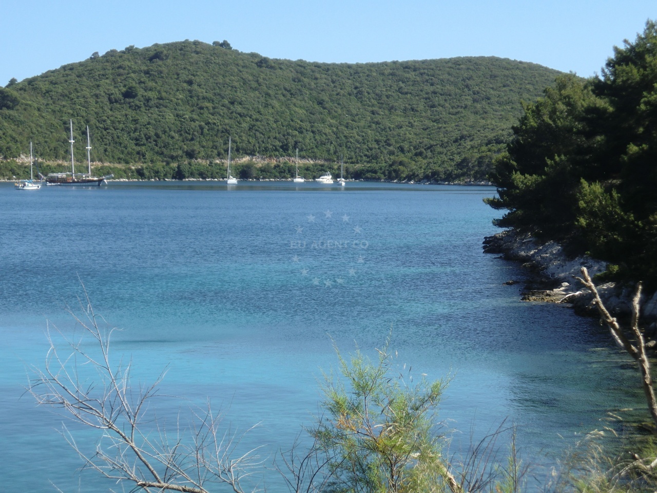 Lokve Anchorage in Pomena, Mljet, Croatia with sandy seabed and distant coastal views