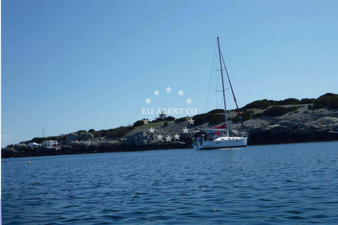 Yacht anchored at Dol, Susac Island with the lighthouse on Trišćavac Point in the distance