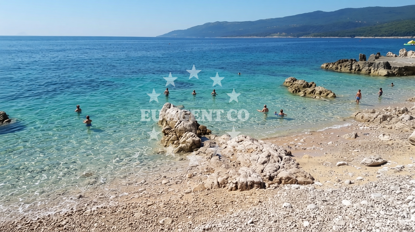 Shoreline and swimming area at Girandella beach in Girandella 7, Rabac