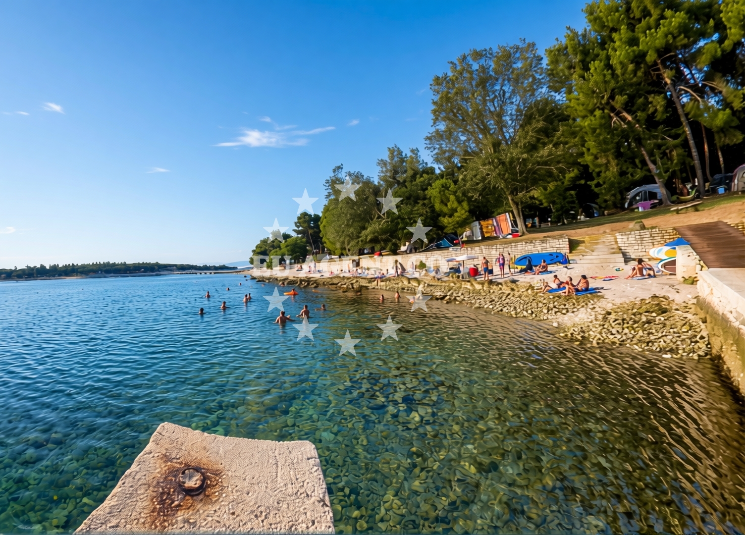 Shoreline and swimming area at Koversada Naturist Beach in Koversada 1, Vrsar