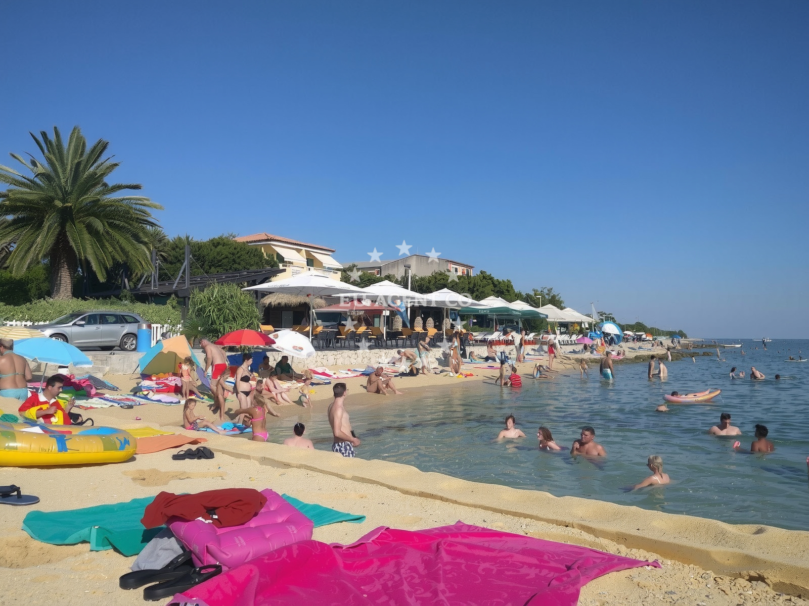 Shoreline and swimming area at Mandre beach in Rijecka 31, Mandre