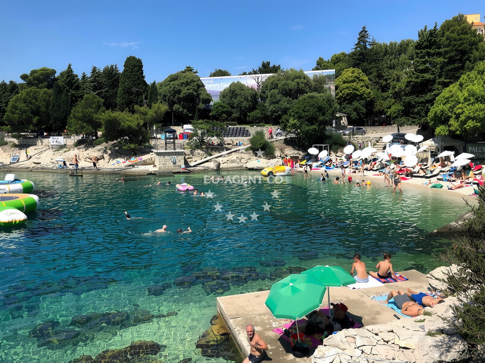 Shoreline and swimming area at Marsal Tito beach in Girandella 7, Rabac