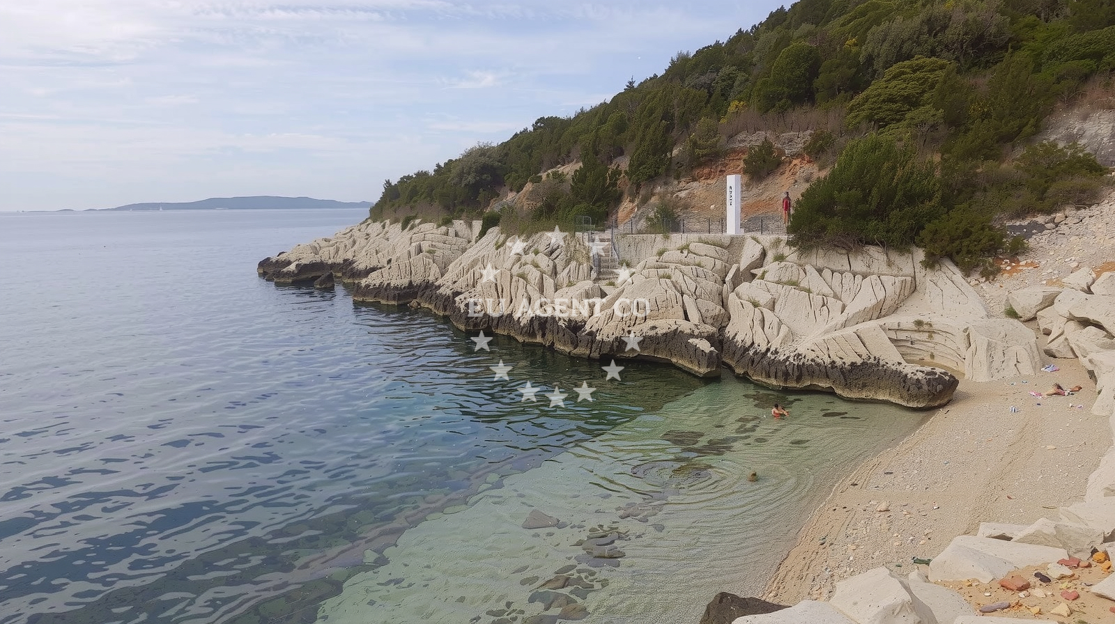 Shoreline and swimming area at Orlice beach in , Trogir