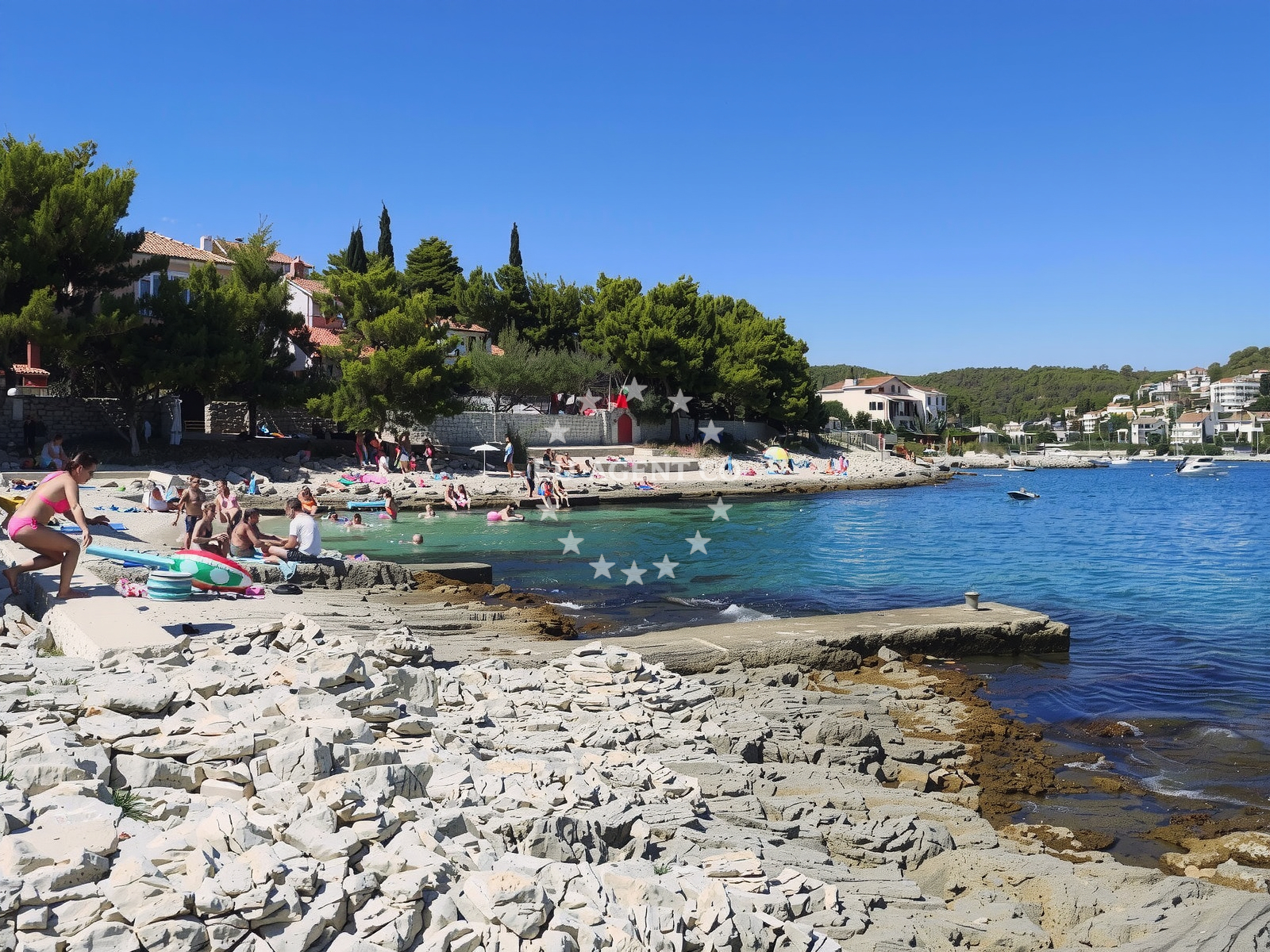 Shoreline and swimming area at Plaza Bocici in Put Barbine, Trogir