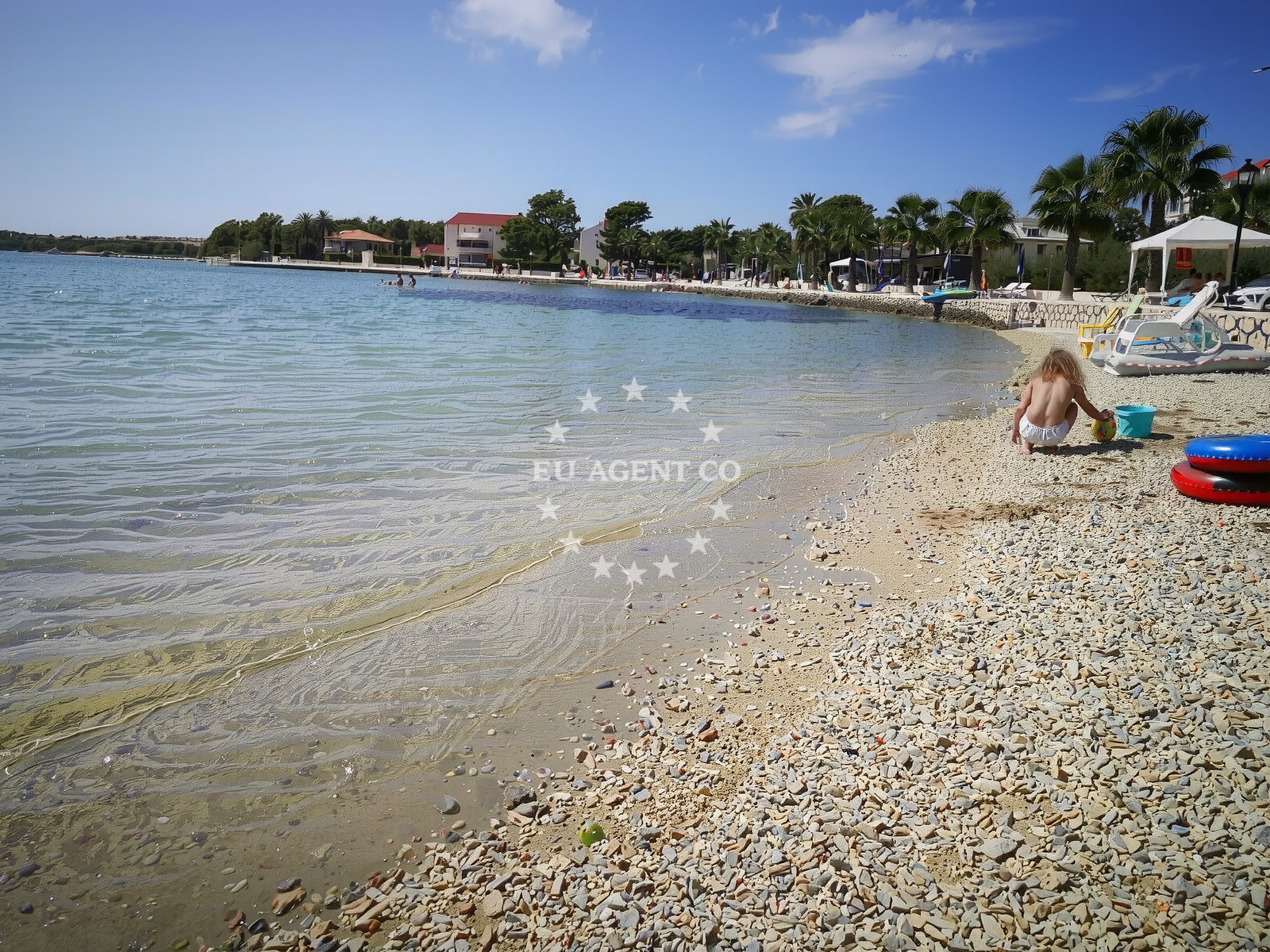 Shoreline and swimming area at Plaza Radovanjica in Virski put 21, Vir