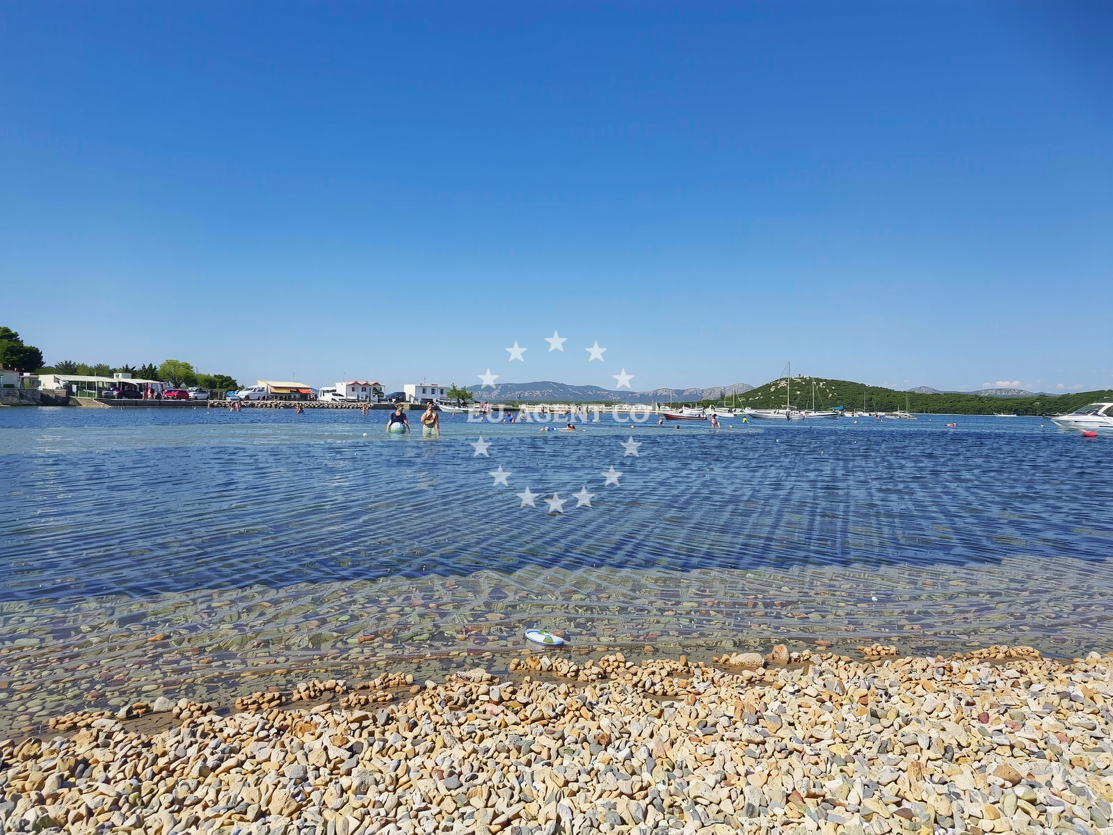 Shoreline and swimming area at Plitka Vala beach in Obala Petra Krešimira IV 108B, Betina