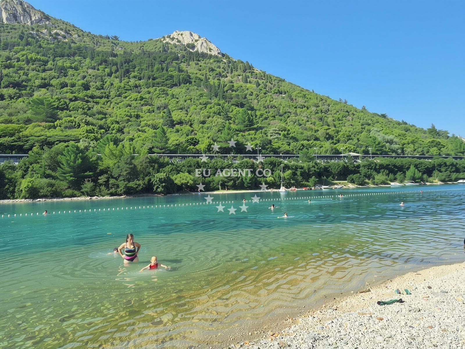Shoreline and swimming area at Plomin Beach in Plomin 69B, Plomin