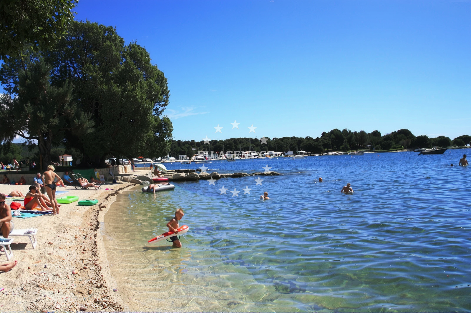 Shoreline and swimming area at Polari beach in Polari 1, Rovinj