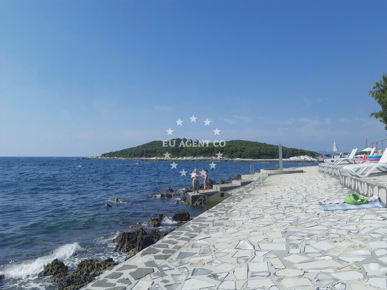 Shoreline and swimming area at Porto Sole beach in Petalon, Vrsar