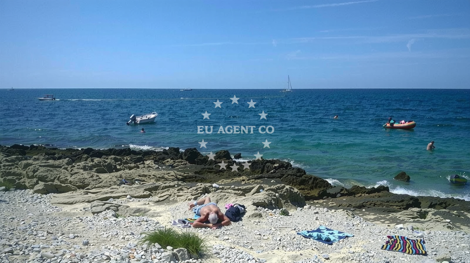 Shoreline and swimming area at Punta Križ beach in Monsena 1, Rovinj