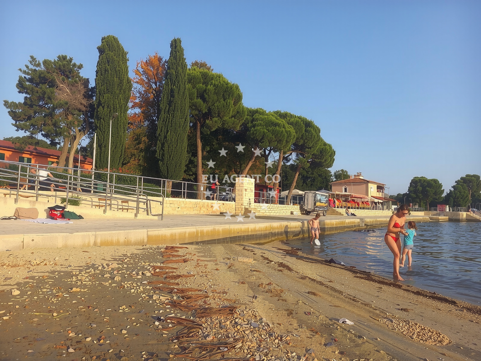 Sea and coastal view of Umag Sand Beach in 12 Gian Rinalda Carlia, Umag